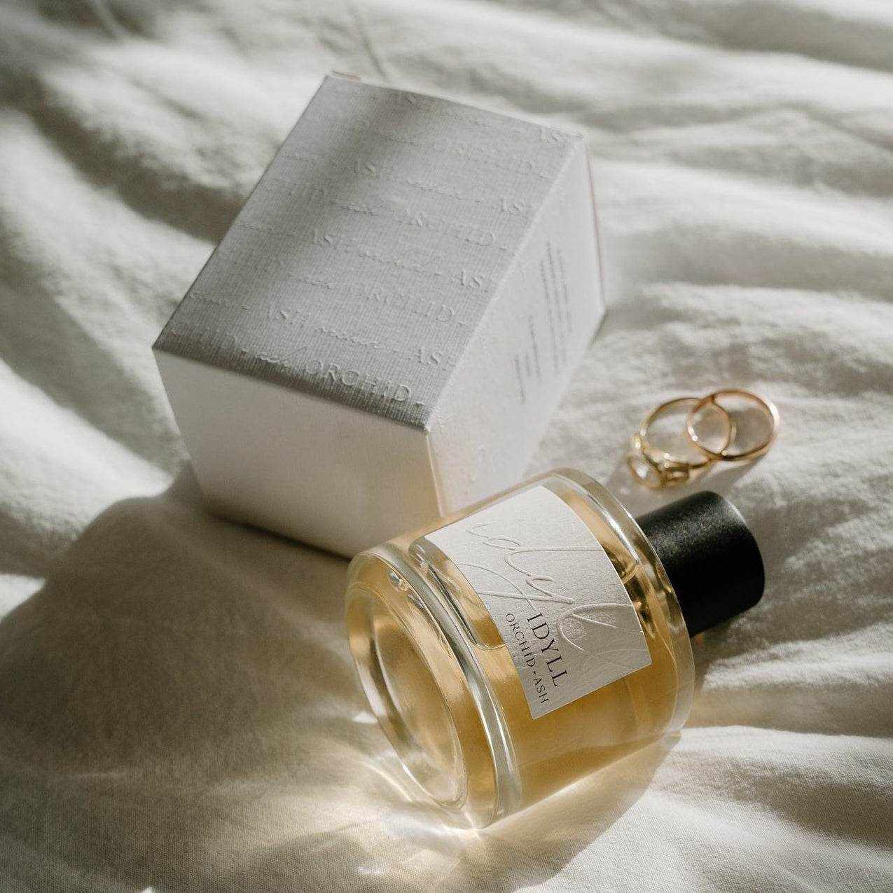 IDYLL perfume bottle with jasmine incense and vanilla scent