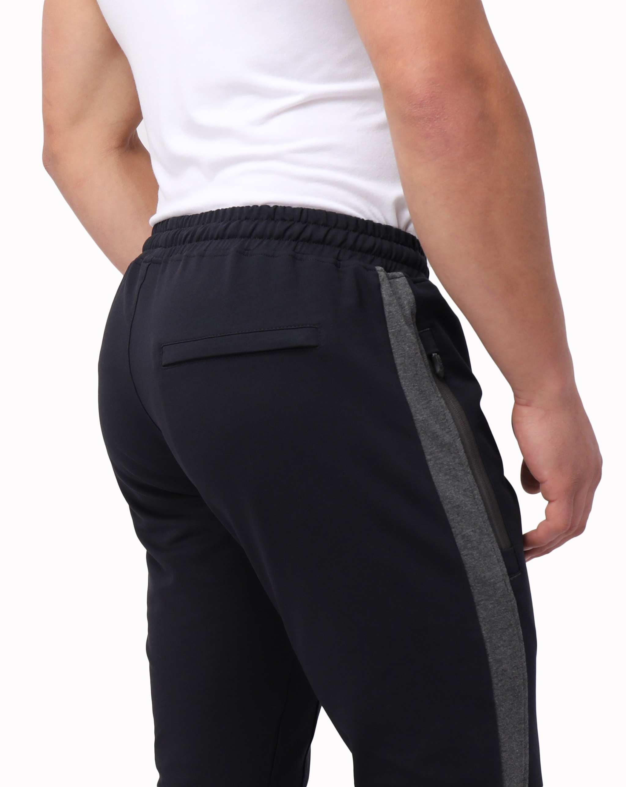 Infinite Flex Jogger in black stretch fabric with charcoal side panels, elastic waistband and rear zip pocket