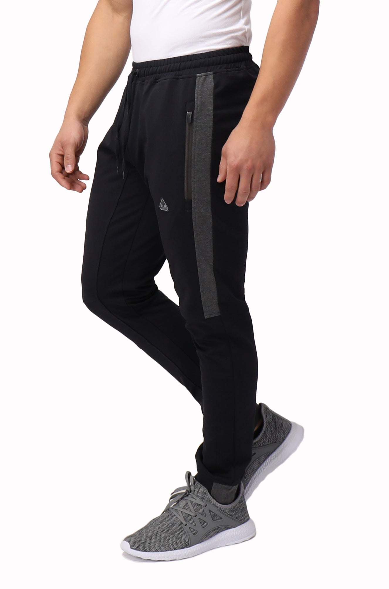 Infinite Flex Jogger in black stretch fabric with a charcoal side stripe, elastic waistband, and tapered cuffed legs