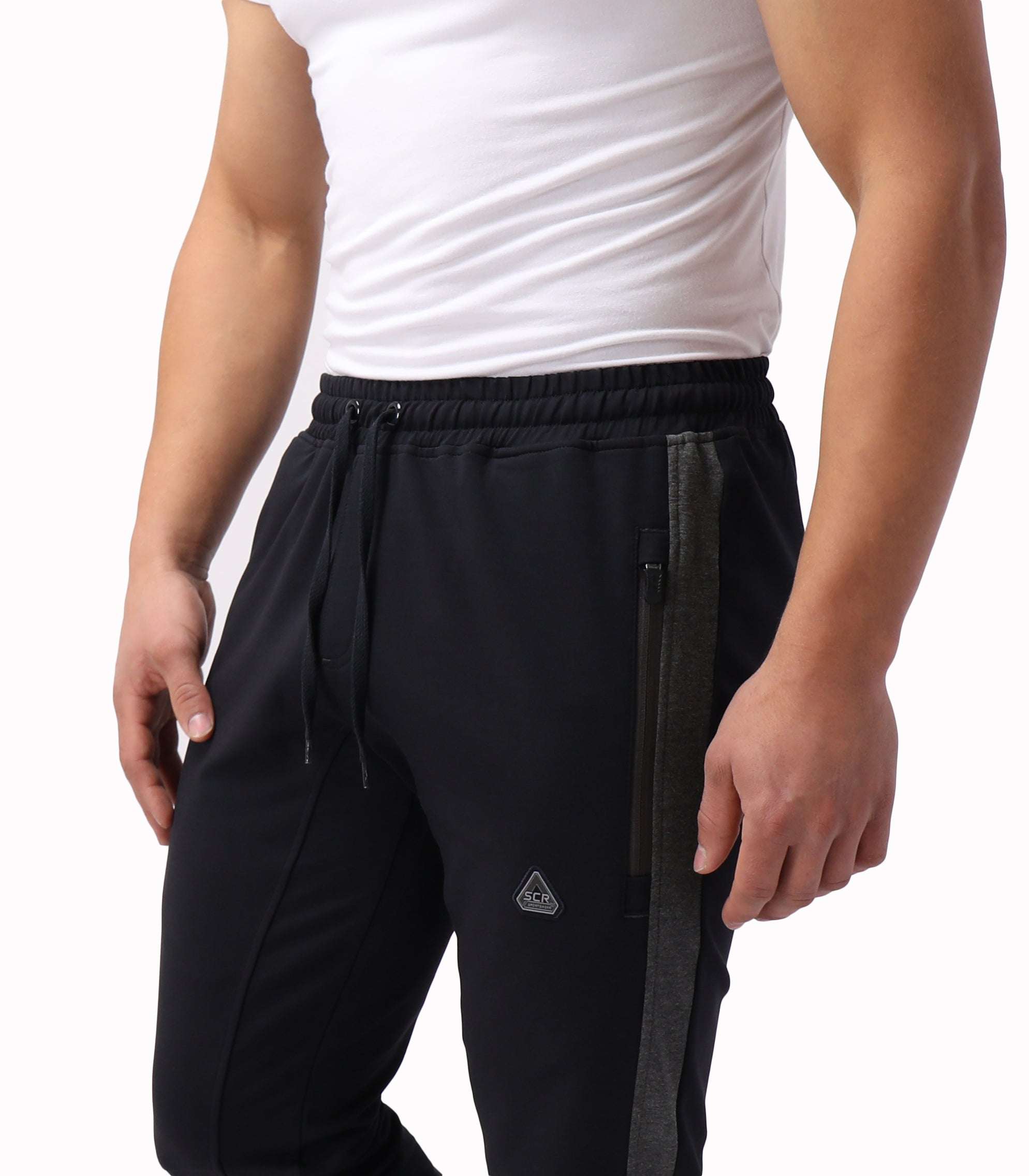 Infinite Flex Jogger in black stretch fabric with elastic drawstring waist, dark side stripe and zippered pocket