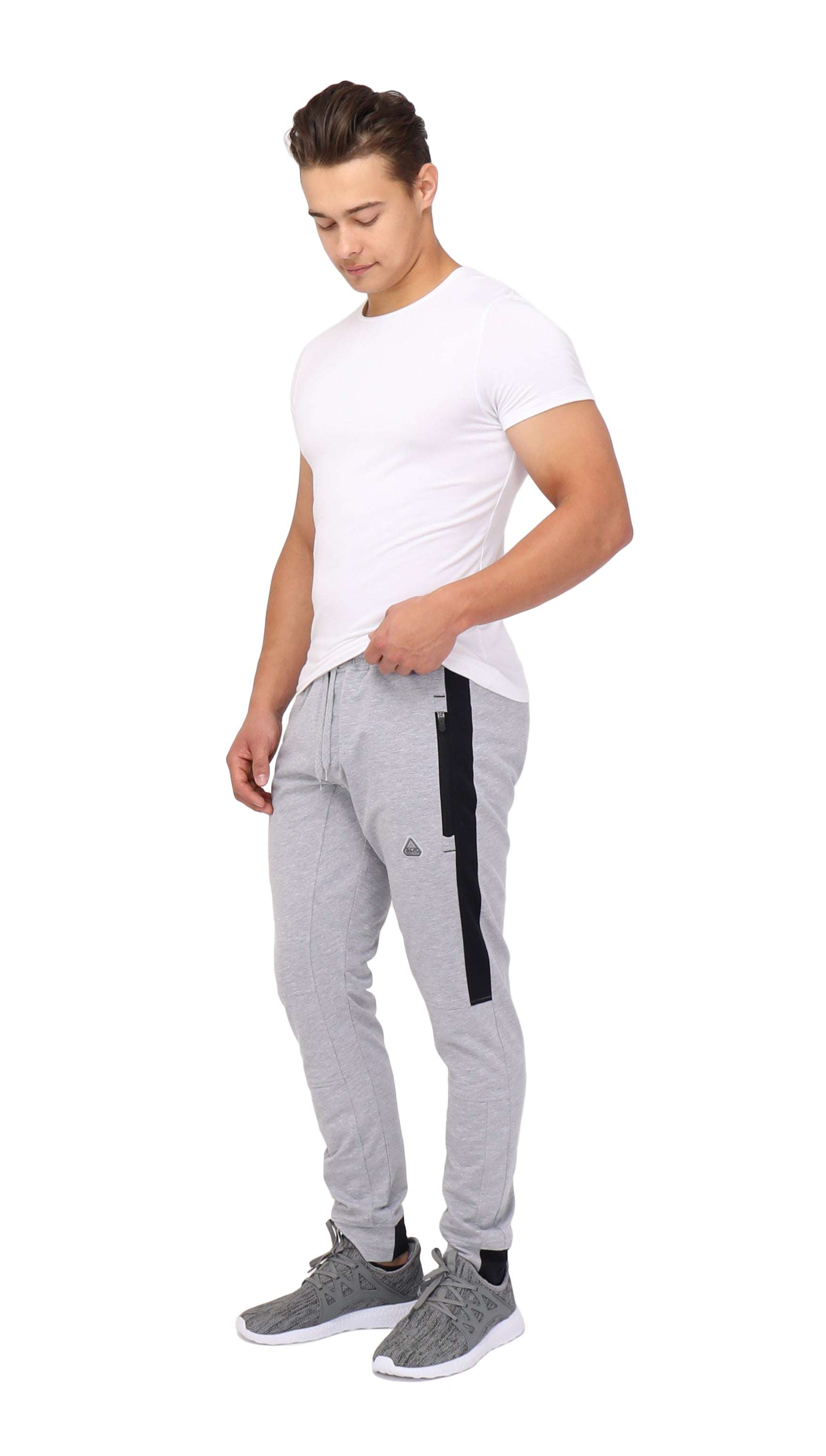 Infinite Flex Jogger in light gray cotton blend with tapered cuffs, black side pocket trim and drawstring waist.