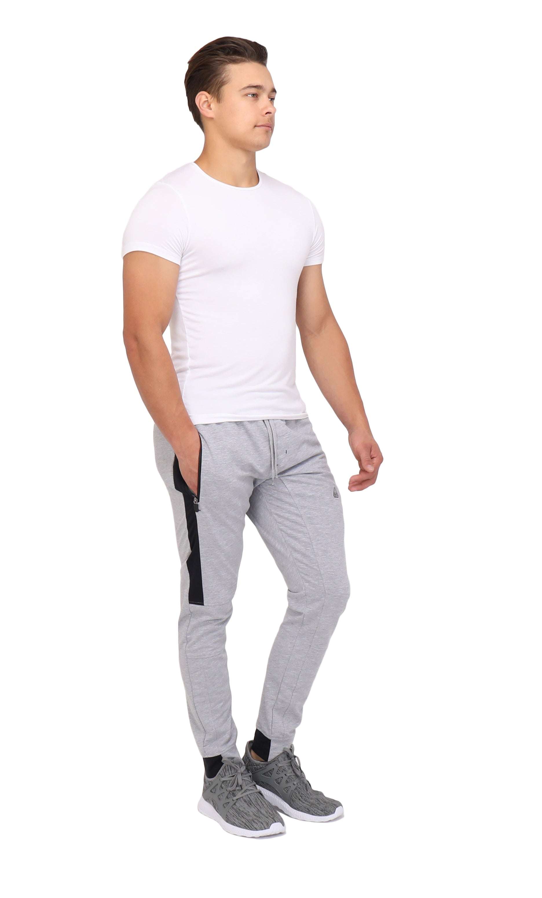 Infinite Flex Jogger in light gray stretch fabric with a tapered cuffed leg and black side pocket trim.