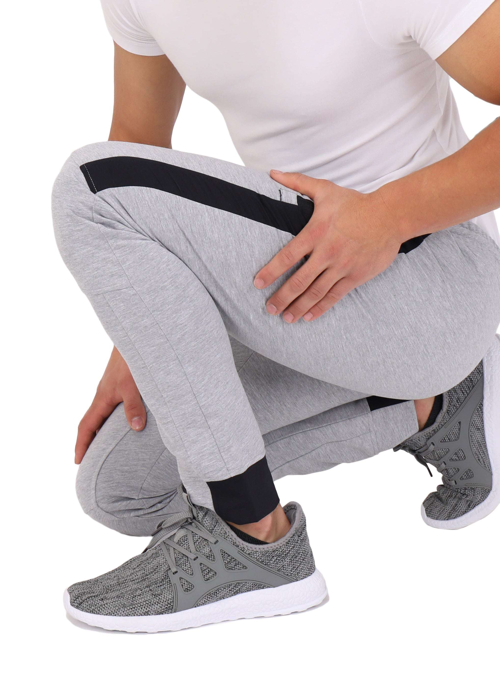 Infinite Flex Jogger in light gray heathered stretch fabric, with black side panels and cuffed ankles