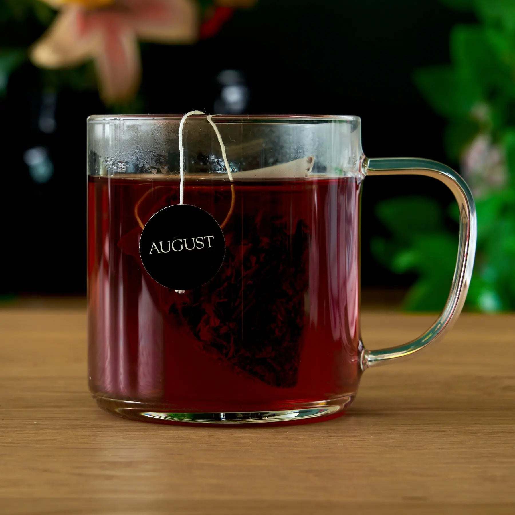 Jet Black - Roasty Coffee Black Tea - 15 Bags, dark amber tea in a clear glass mug with tea bag
