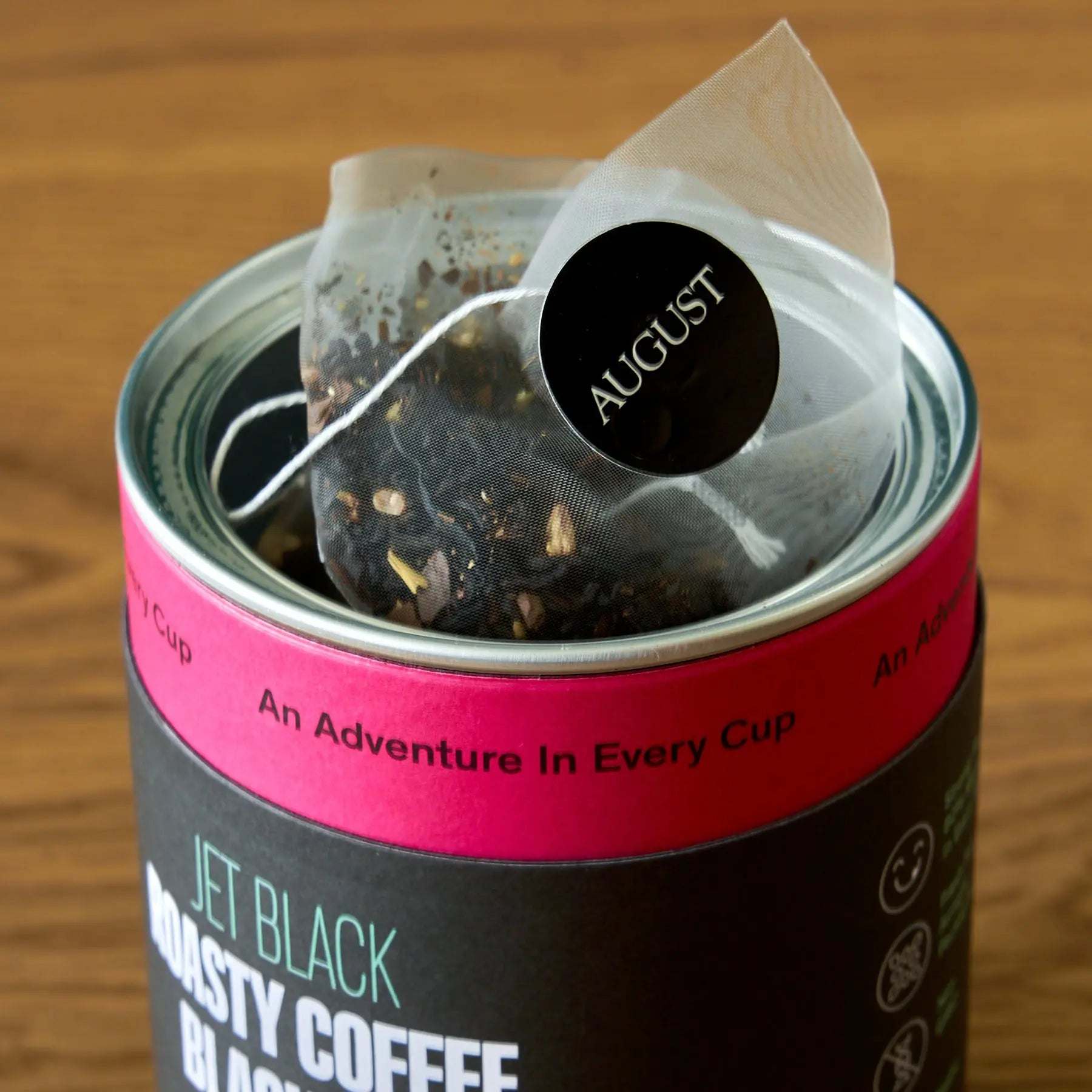 Jet Black - Roasty Coffee Black Tea - 15 Bags in a black tin with loose tea bags visible
