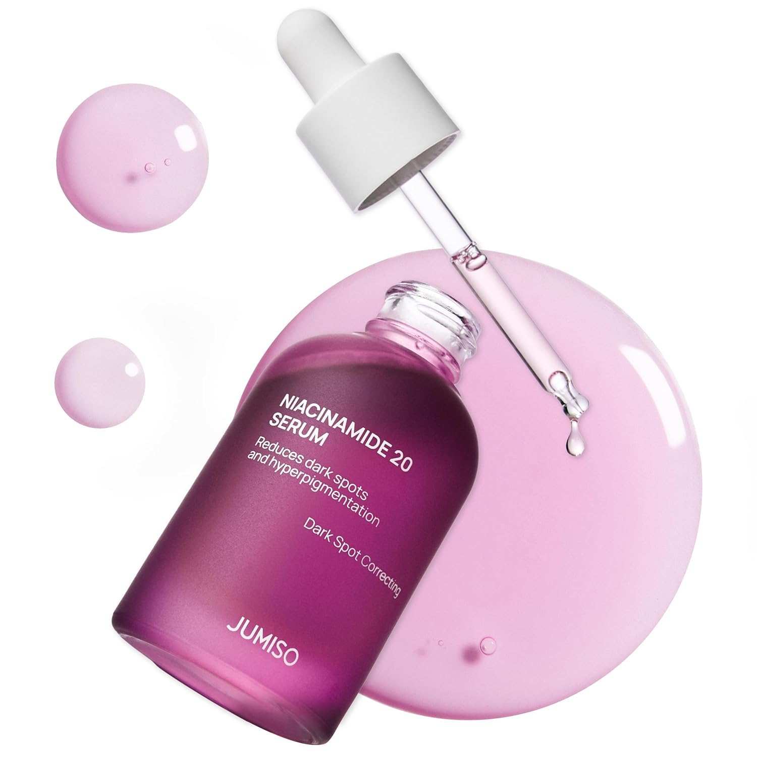 JUMISO Niacinamide 20 Serum in a purple frosted glass bottle with a white dropper and pink serum drops