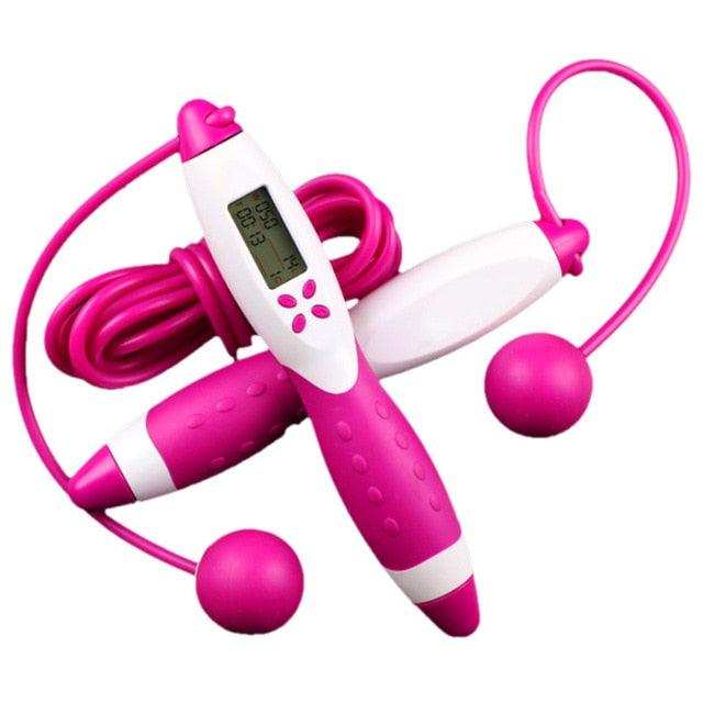 Pink and white cordless jump ropes with ergonomic handles and an electronic counter display, featuring weighted balls for indoor use, Jump Ropes With Electronic Counting.