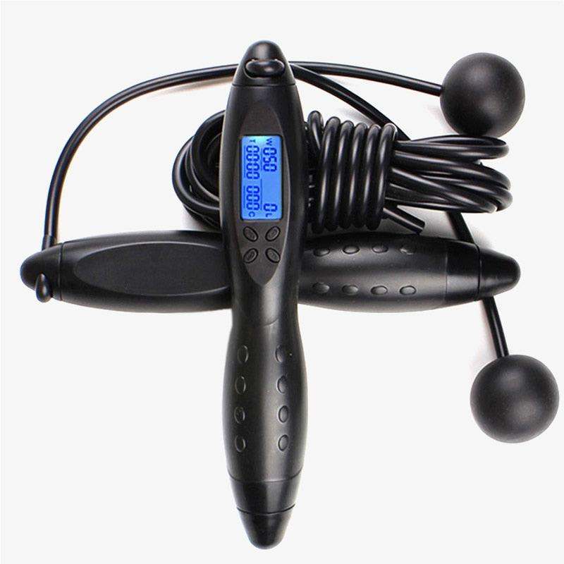 Black cordless rubber jump rope with ergonomic handles and digital display screen showing workout stats, Jump Ropes With Electronic Counting