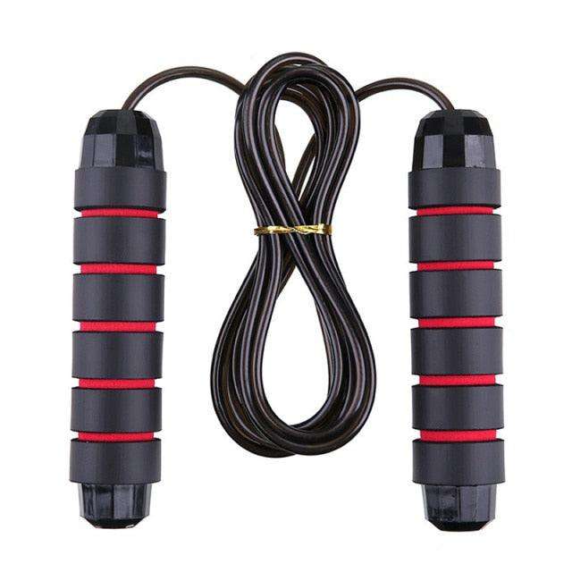 Jump Ropes With Electronic Counting featuring black ergonomic handles with red grip accents and a coiled black rubber rope for fitness workouts.