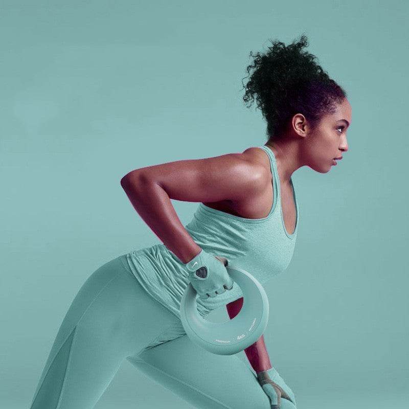 Ladies Fitness Dumbbell slim circular design in light blue held by woman wearing matching activewear and gloves