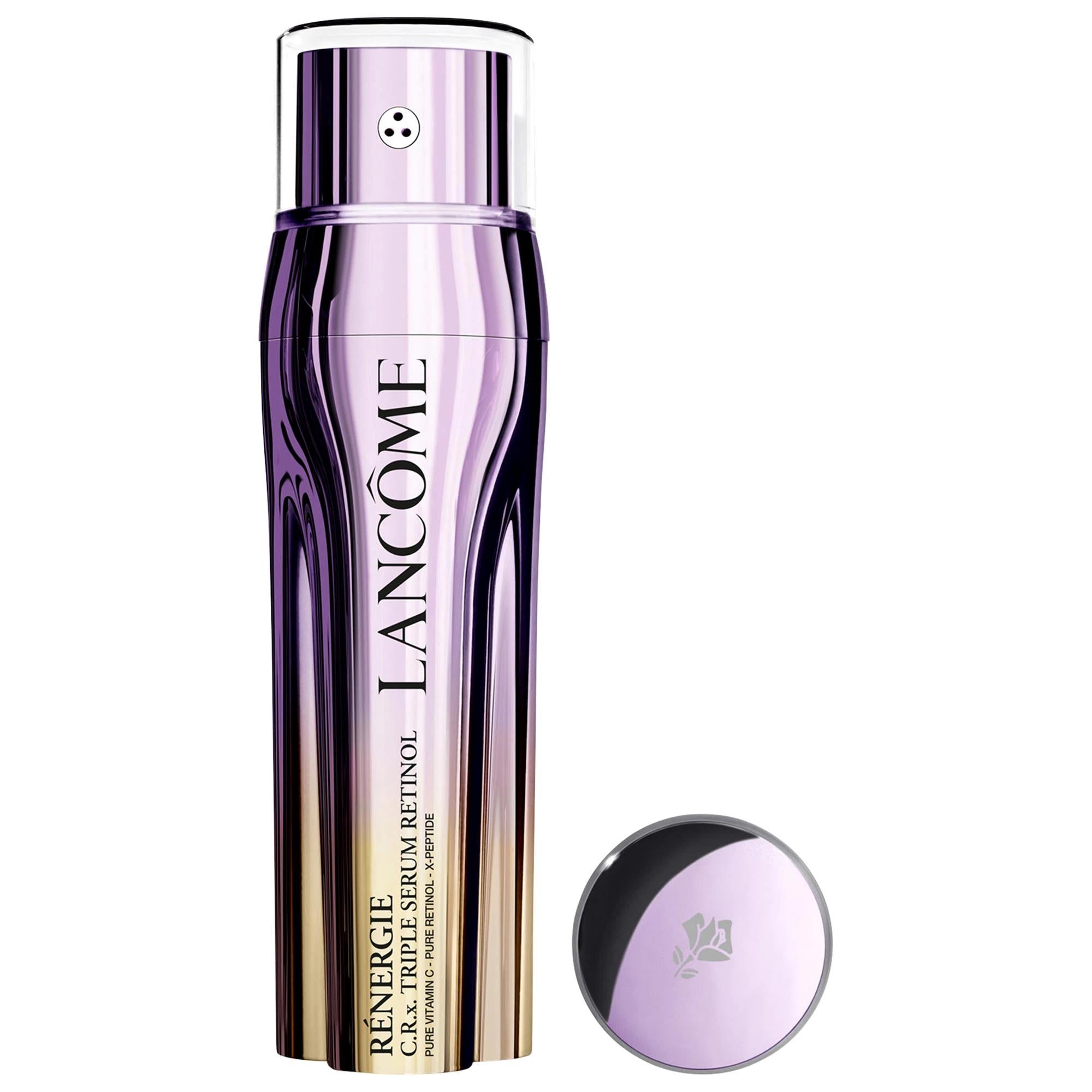 Triple serum bottle, Lanc™me RŽnergie C.R.X. Triple Serum, in reflective lavender and black packaging with a matching round cap beside it.