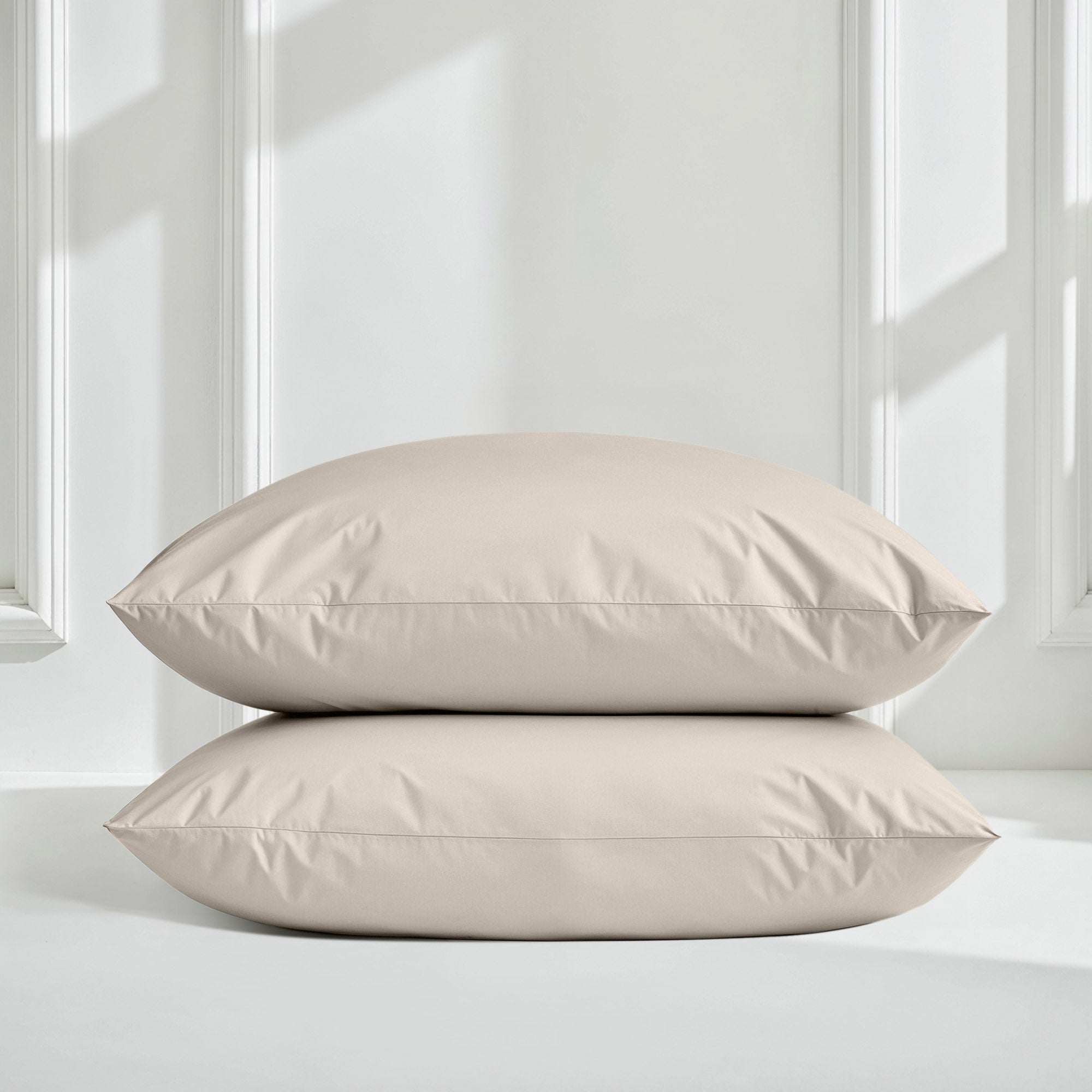 Luxe Australian Sateen Bedding pillowcases in pale beige cotton sateen, smooth solid fabric with crisp stitched edges