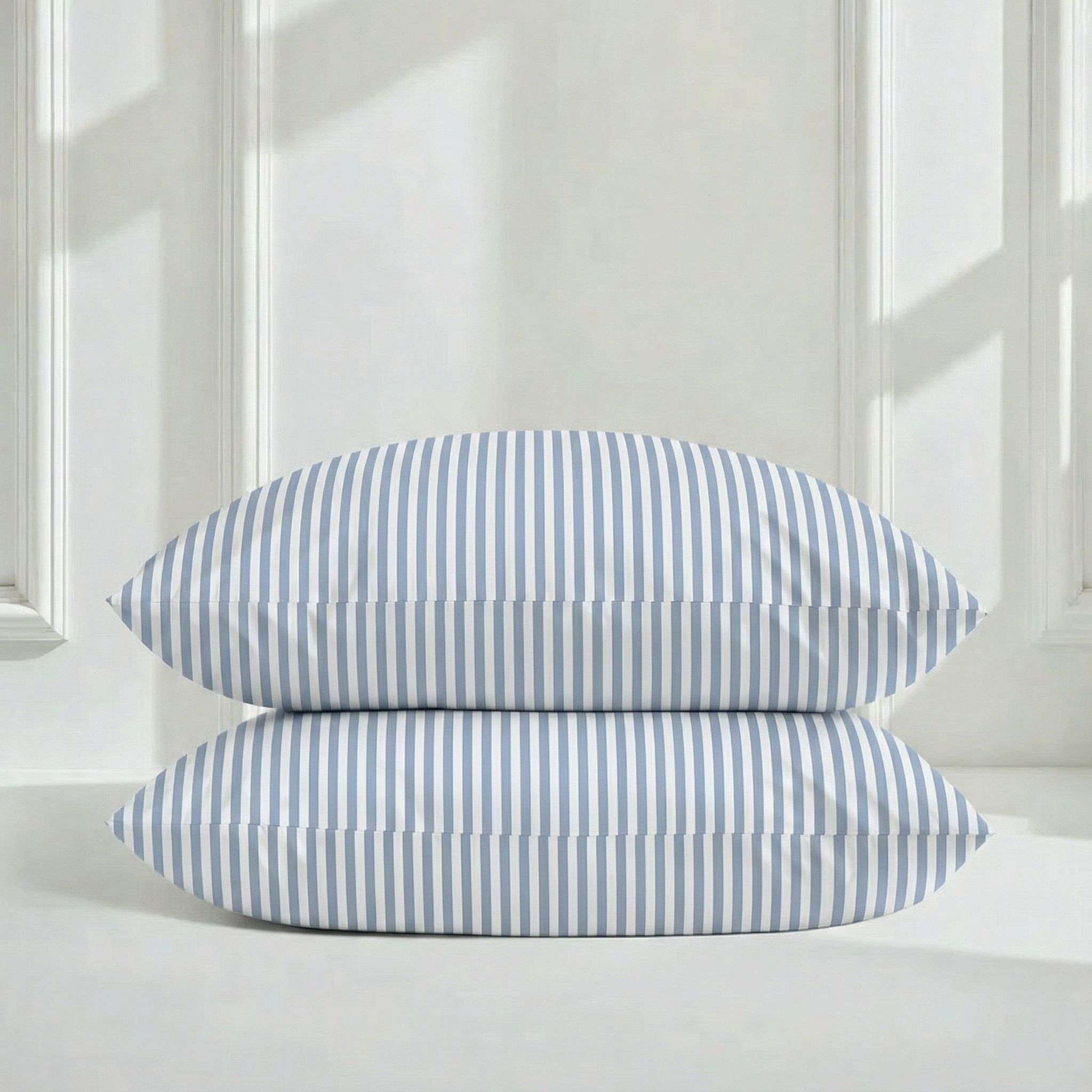 Luxe Australian Sateen Bedding pillowcases in white cotton with crisp blue vertical stripes and a smooth sateen finish