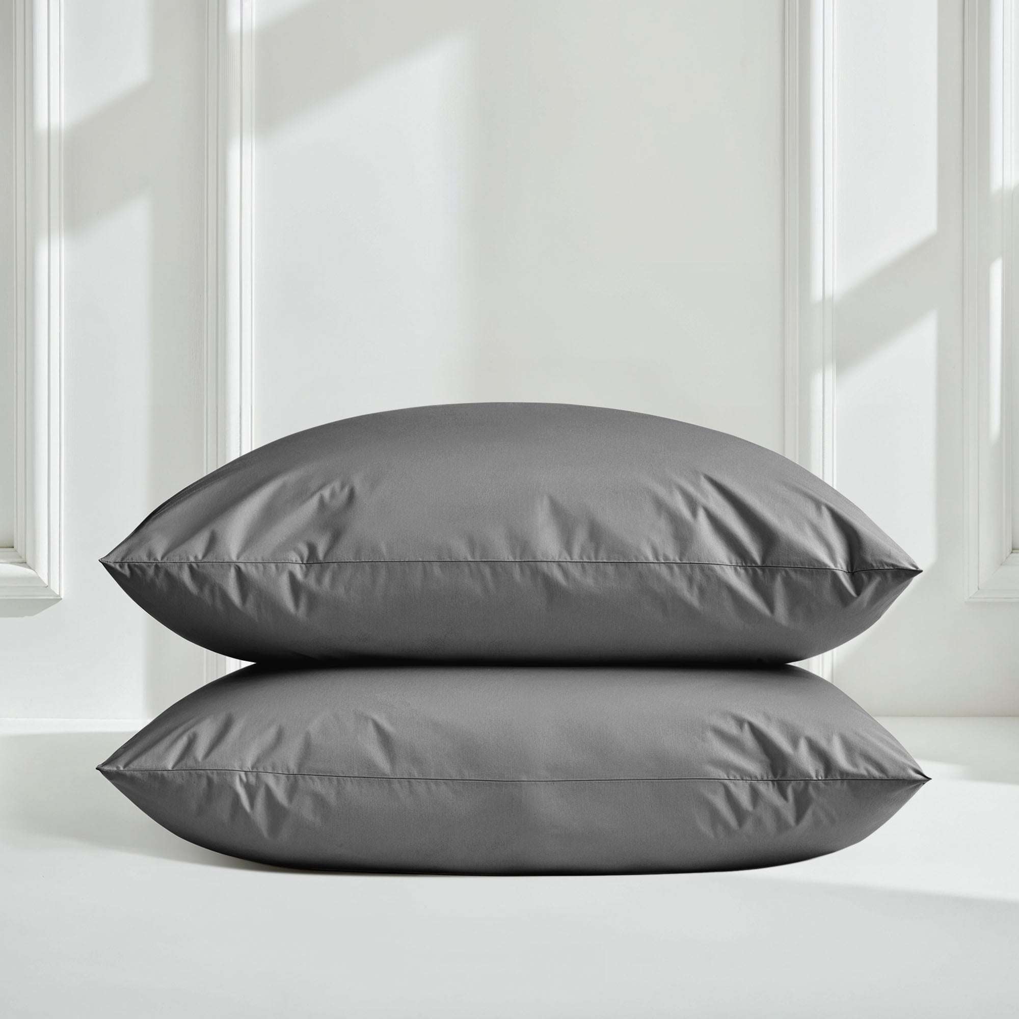 Luxe Australian Sateen Bedding pillowcases in smooth charcoal gray cotton sateen with crisp stitched edges