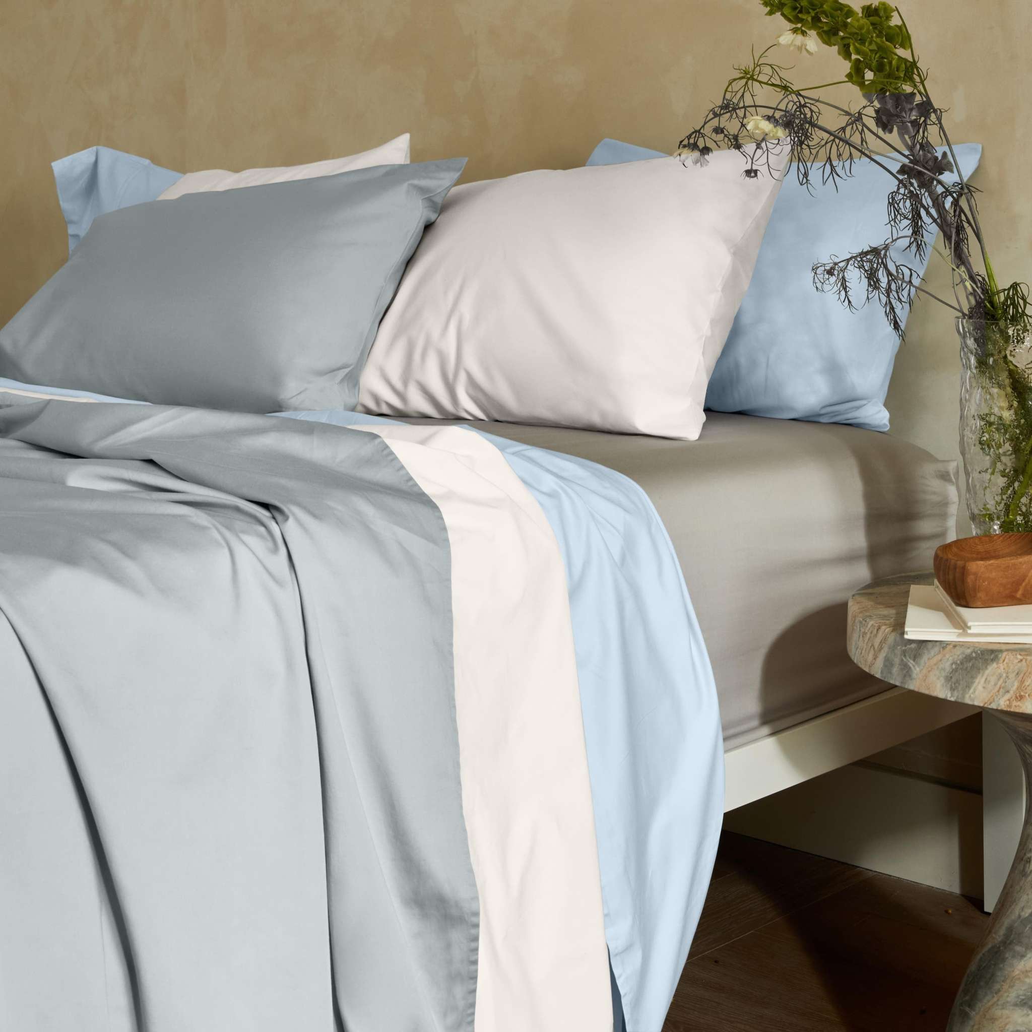 Luxe Australian Sateen Bedding in smooth cotton, with pale blue and white sheets and coordinating pillowcases