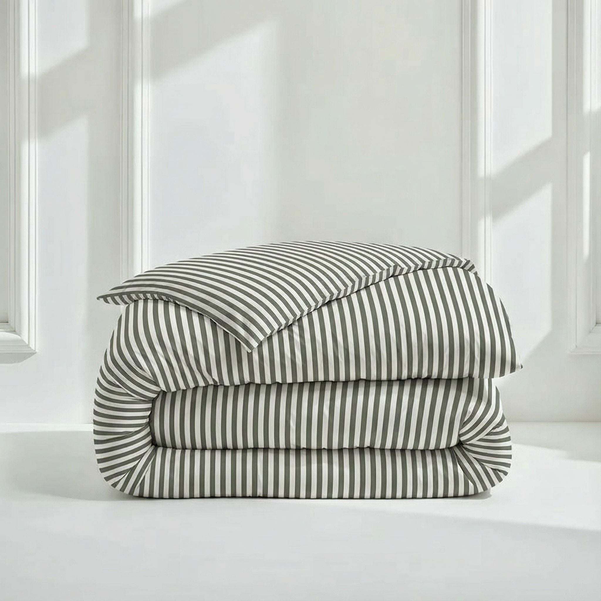 Luxe Australian Sateen Bedding folded in crisp white cotton with narrow charcoal vertical stripes and a soft sateen finish