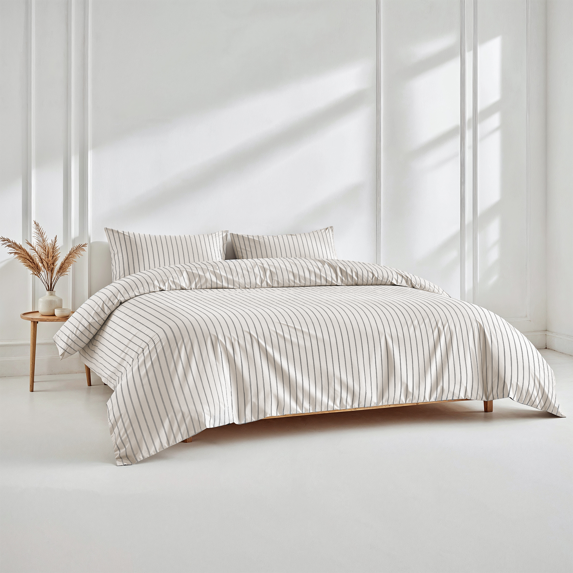 Luxe Australian Sateen Bedding in white cotton with fine charcoal pinstripes, featuring a striped duvet cover and pillowcases