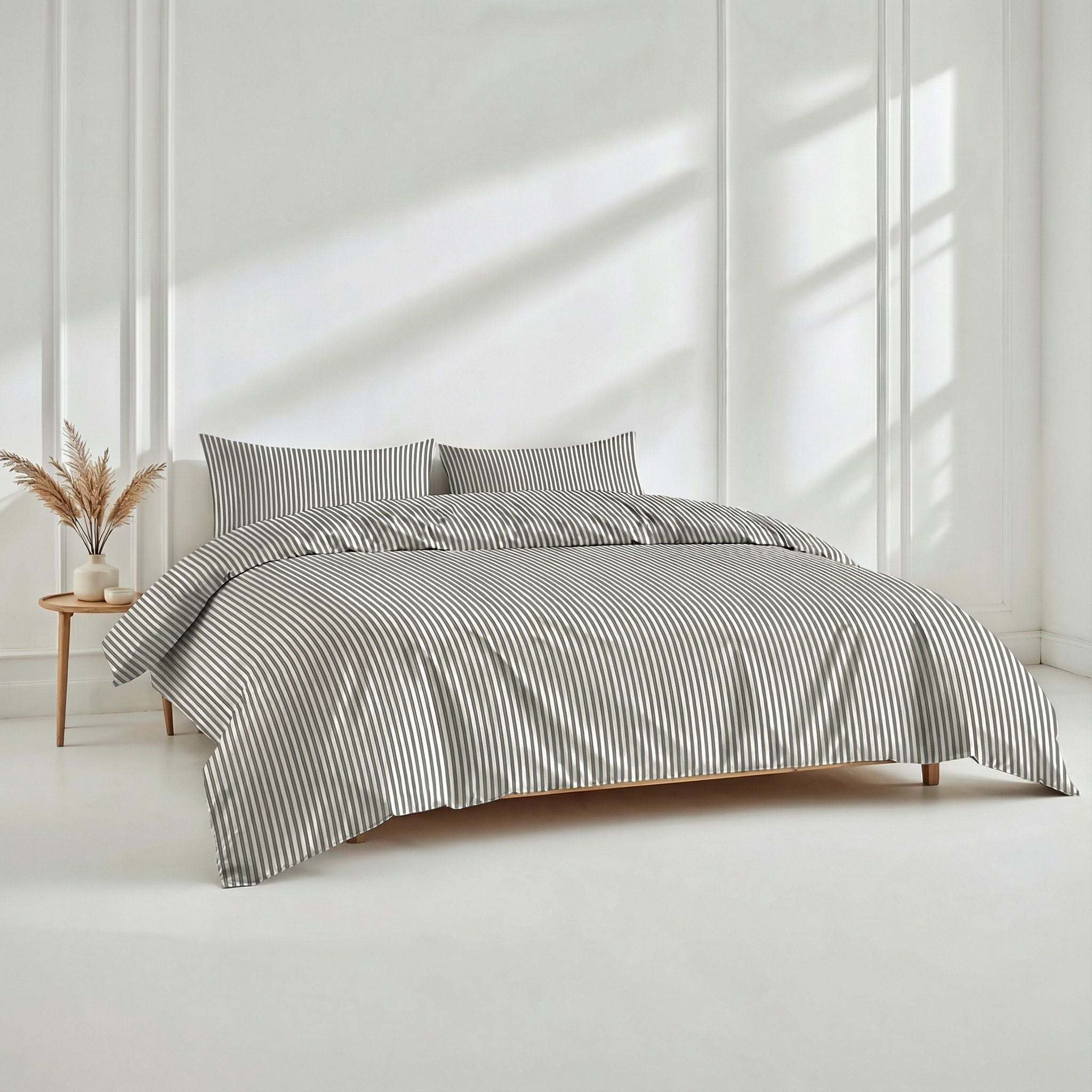 Luxe Australian Sateen Bedding in white cotton with fine charcoal pinstripes, featuring a striped duvet cover and matching pillowcases