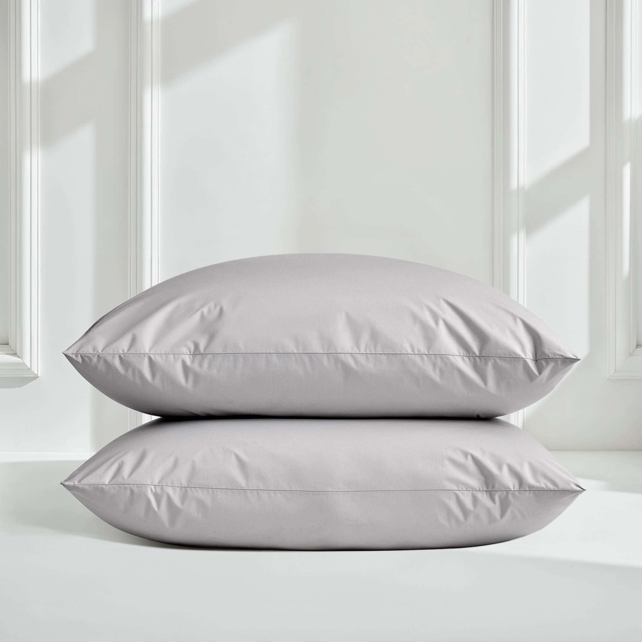 Luxe Australian Sateen Pillowcase Set in soft light grey cotton, shown as two smooth pillowcases with crisp edges