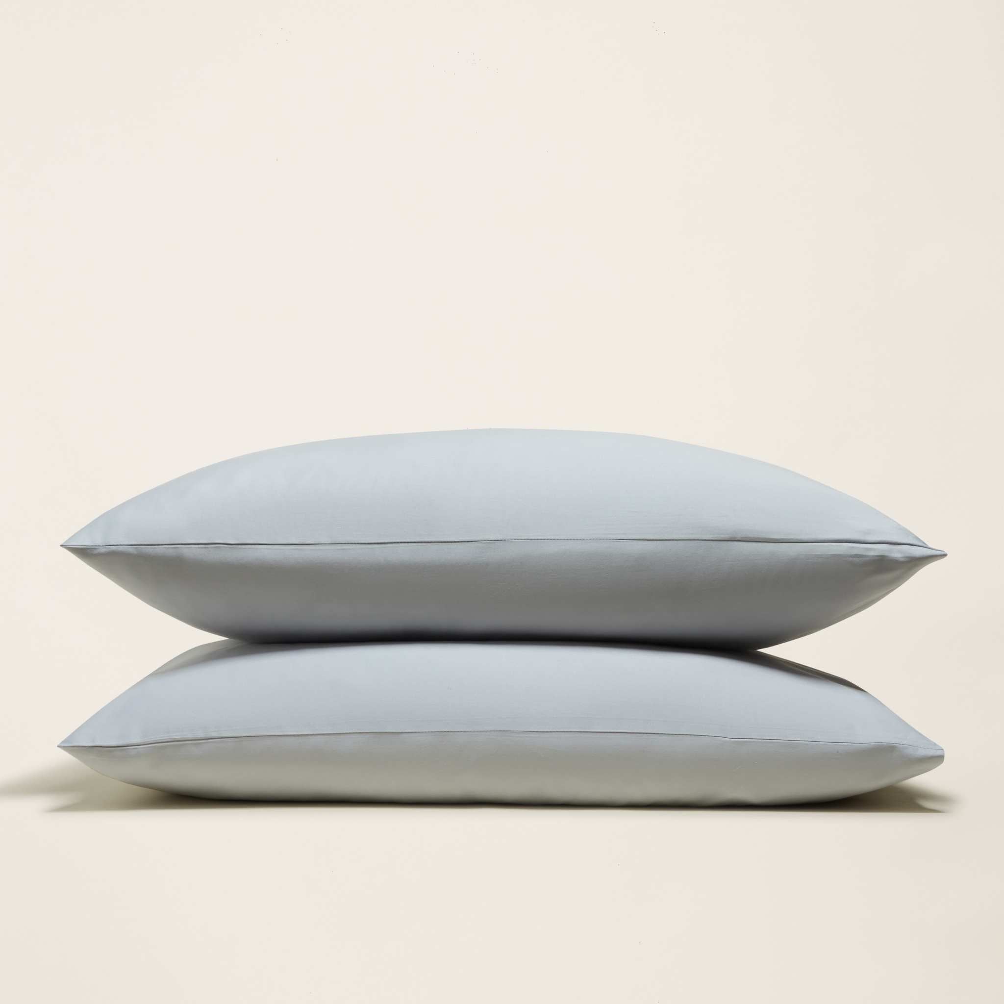 Luxe Australian Sateen Pillowcase Set in pale blue cotton sateen, shown as two smooth pillowcases with clean edges