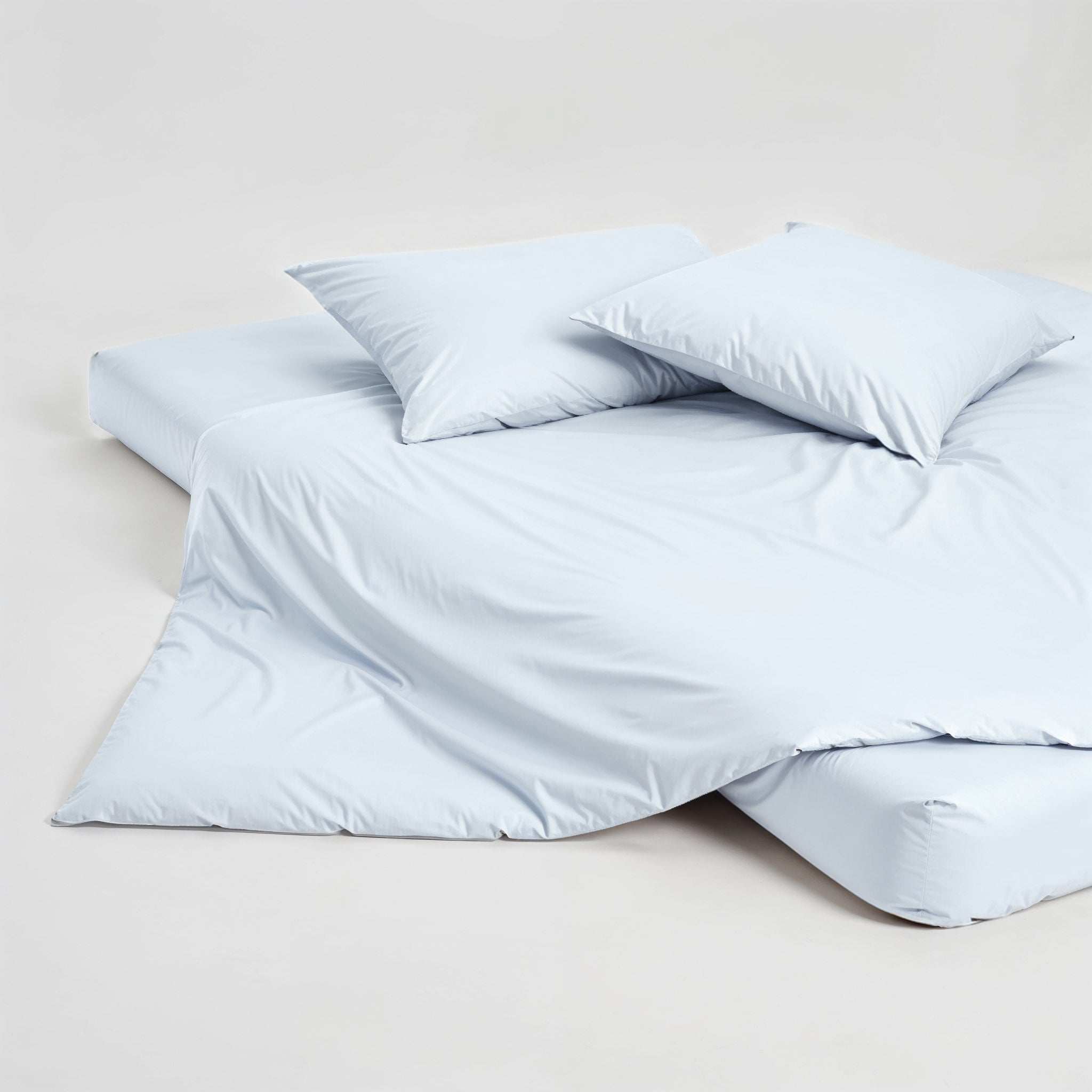 Luxe Australian Sateen Pillowcase Set in pale blue, smooth cotton sateen with two matching pillowcases and bedding