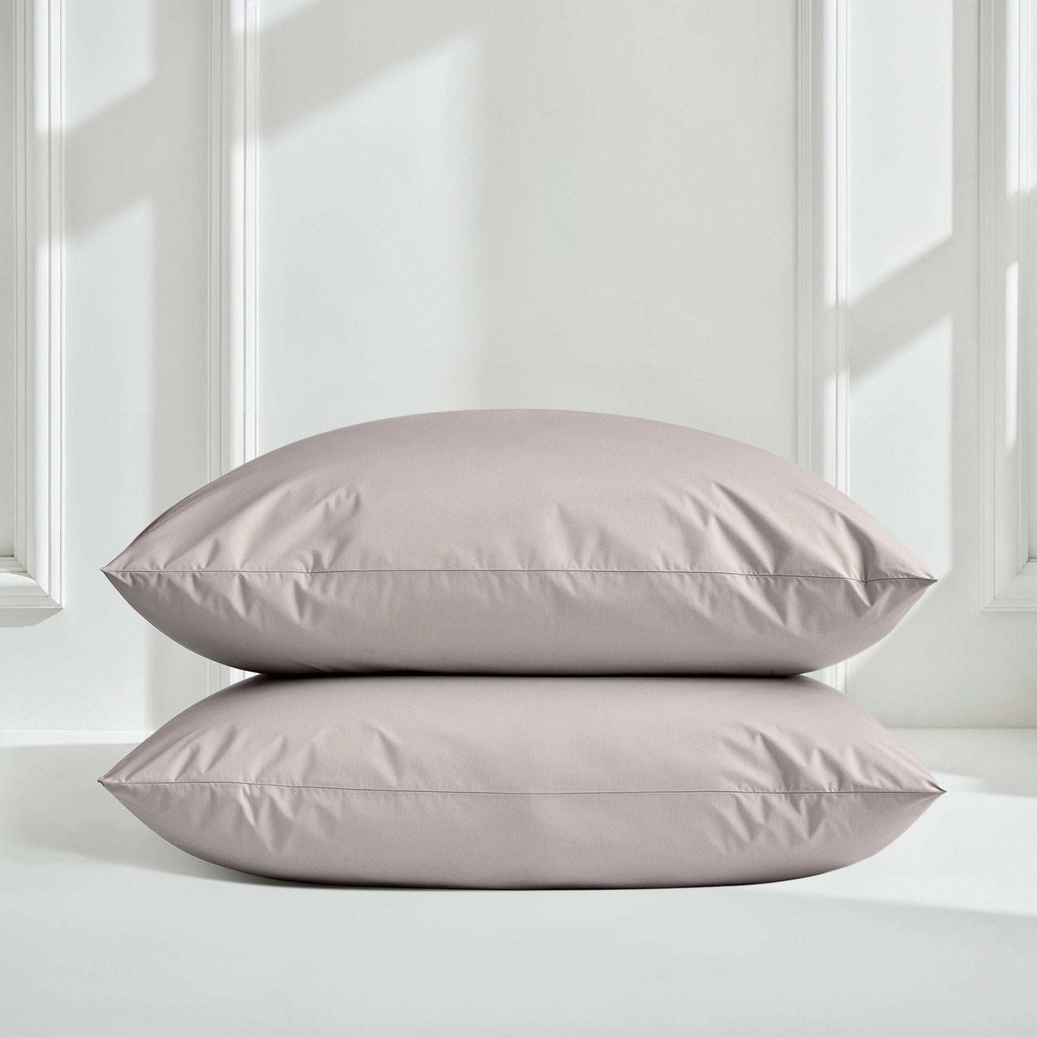 Luxe Australian Sateen Pillowcase Set with two pale mauve cotton pillowcases and clean stitched edges