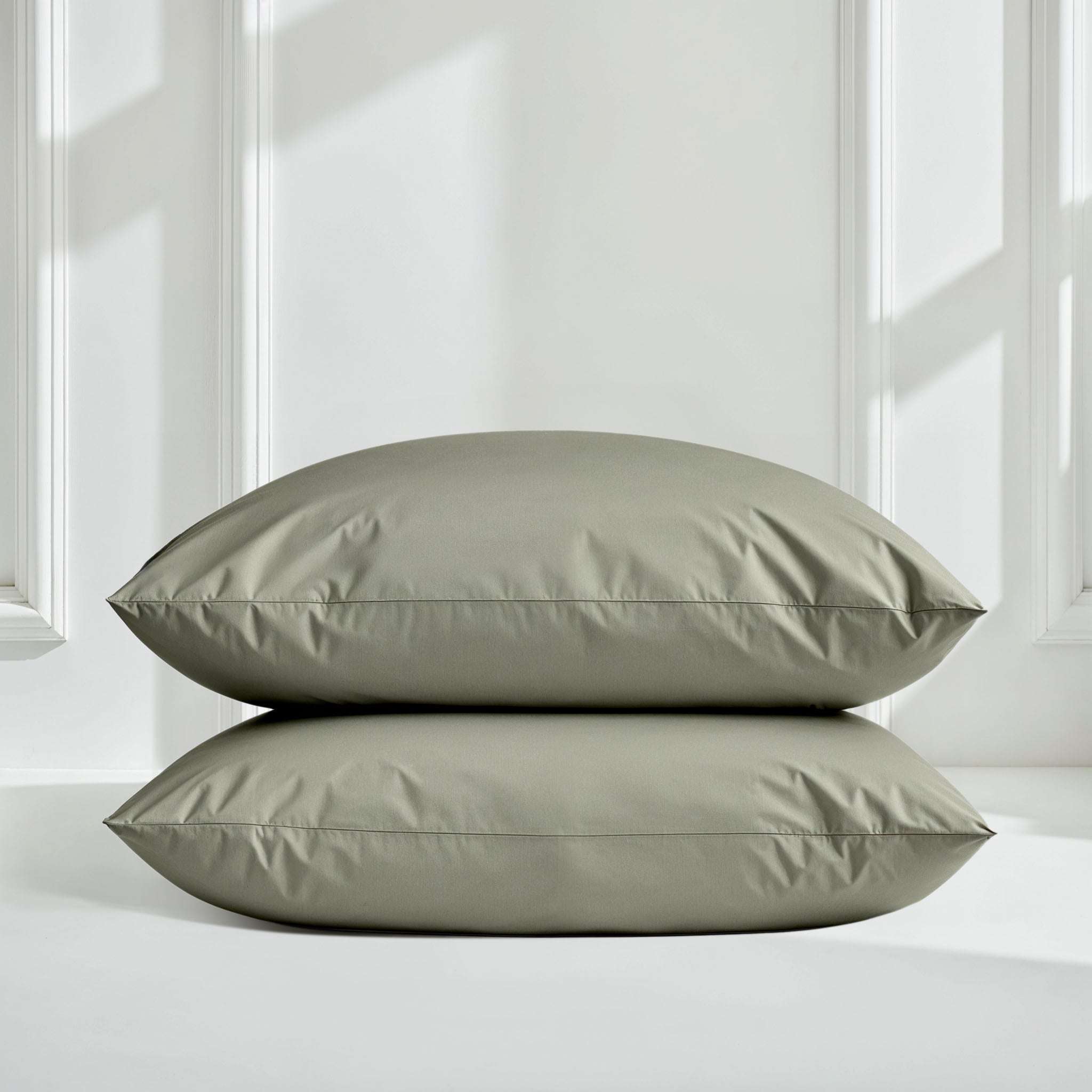 Luxe Australian Sateen Pillowcase Set in muted sage green, smooth cotton sateen with a subtle sheen and tailored seams