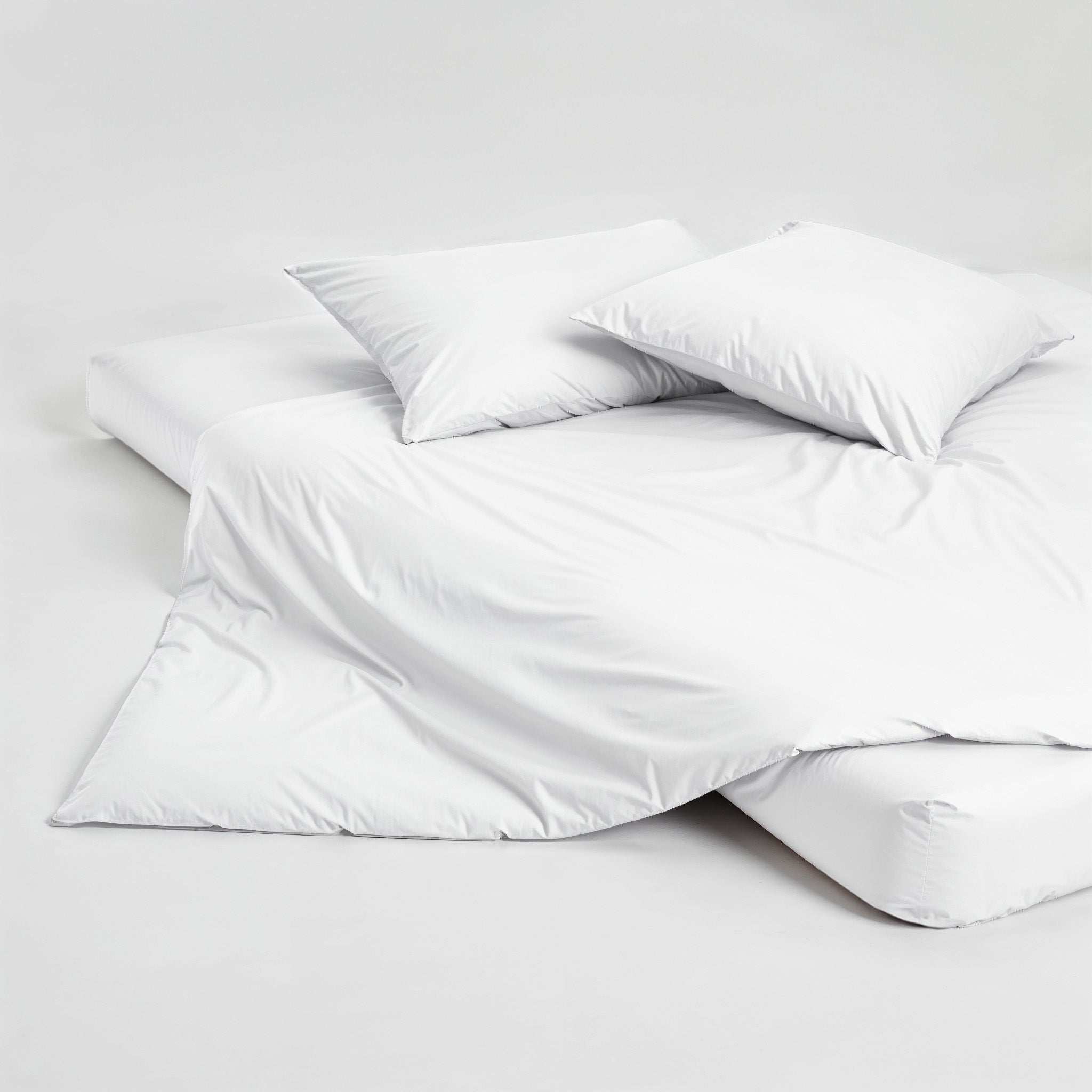 Luxe Australian Sateen Pillowcase Set in smooth white cotton, featuring two pillows with clean, plain fabric