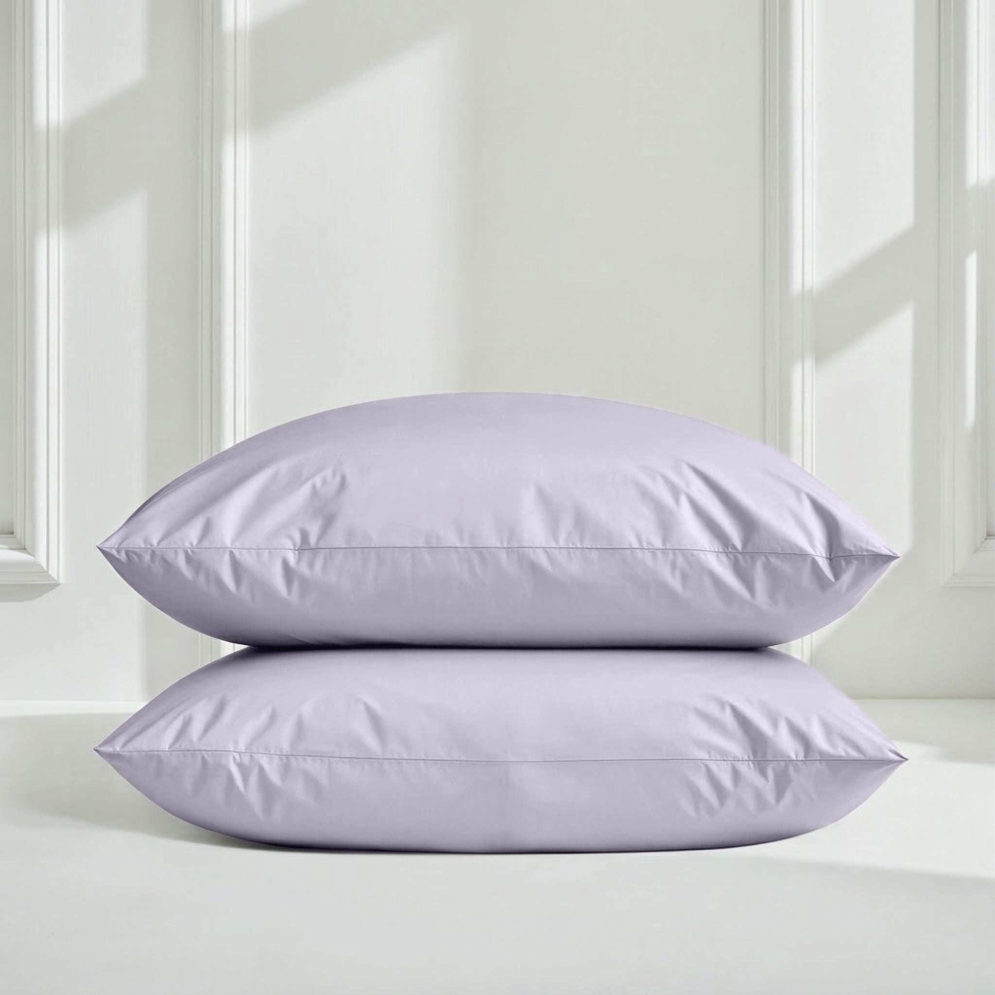 Luxe Australian Sateen Sheet Set featuring two pale lavender cotton pillowcases with smooth sateen and stitched edges