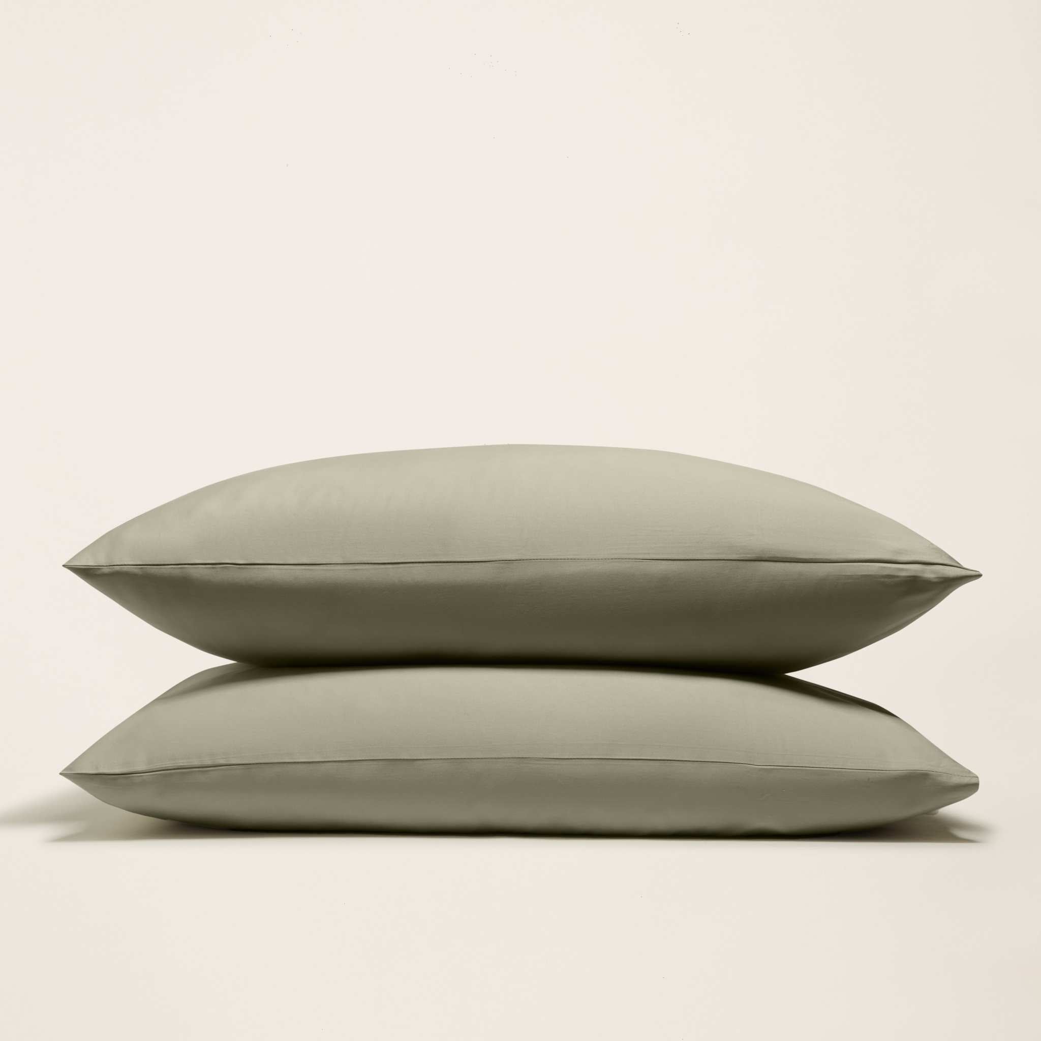 Luxe Australian Sateen Sheet Set with two smooth olive-gray cotton sateen pillowcases, featuring a subtle sheen