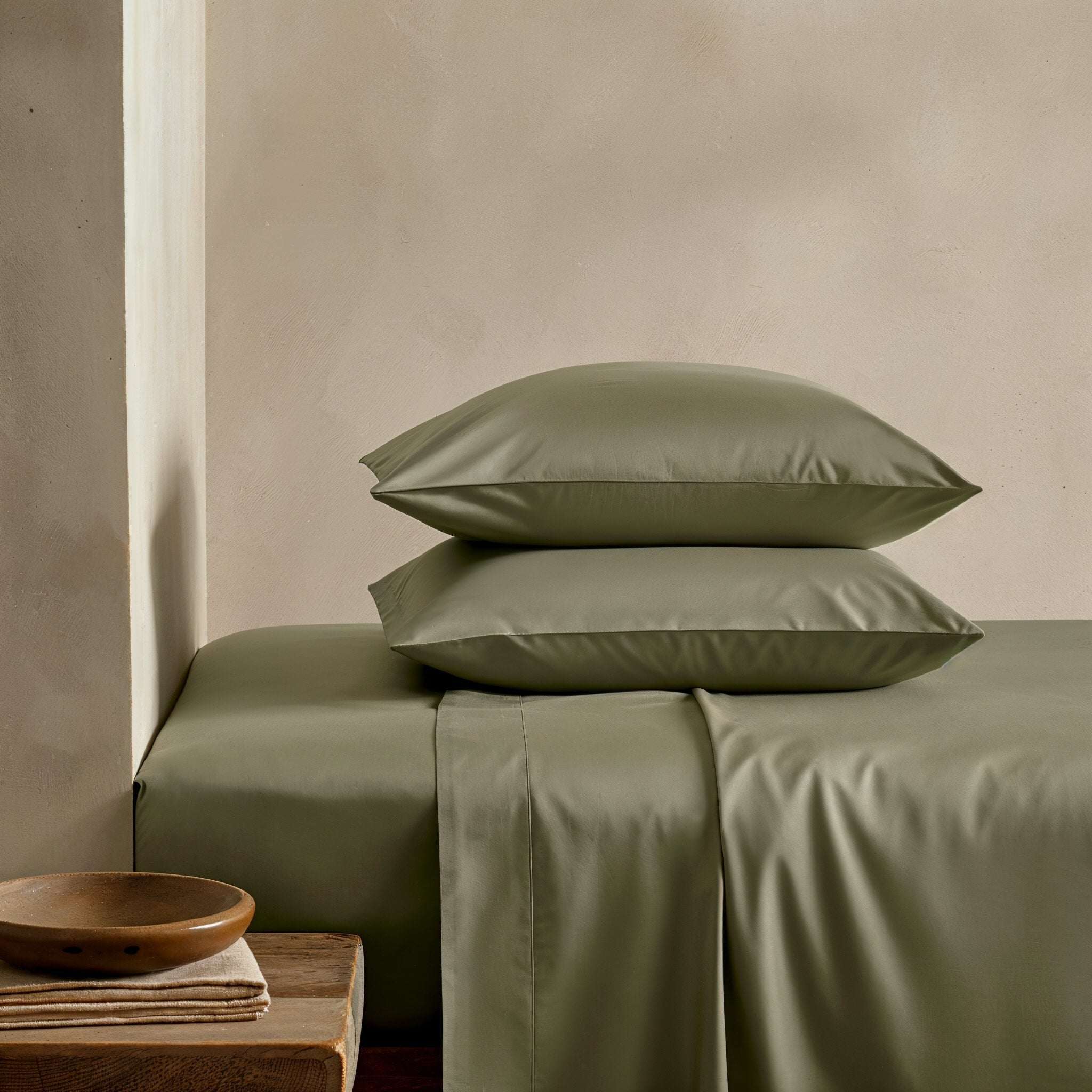 Luxe Australian Sateen Sheet Set in muted olive green cotton sateen, with smooth sheets and two matching pillowcases