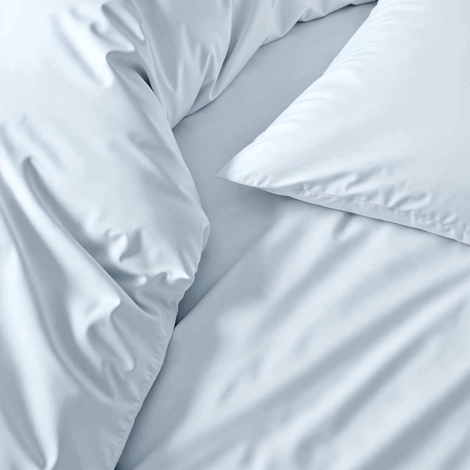 Luxe Australian Sateen Sheet Set in pale blue cotton with a smooth, subtly lustrous finish and soft folds