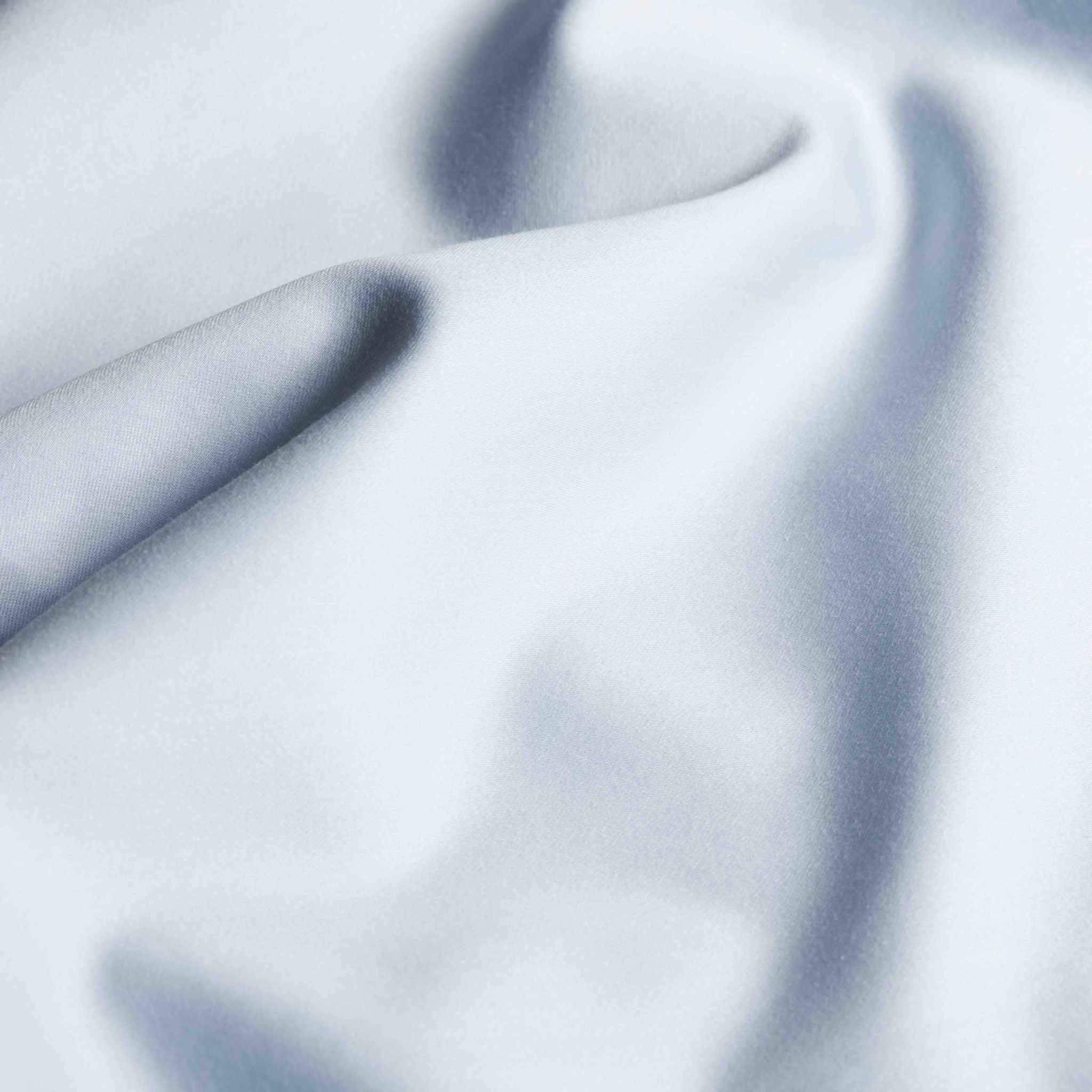 Luxe Australian Sateen Sheet Set in pale blue, smooth cotton sateen with a subtle sheen and soft draped folds