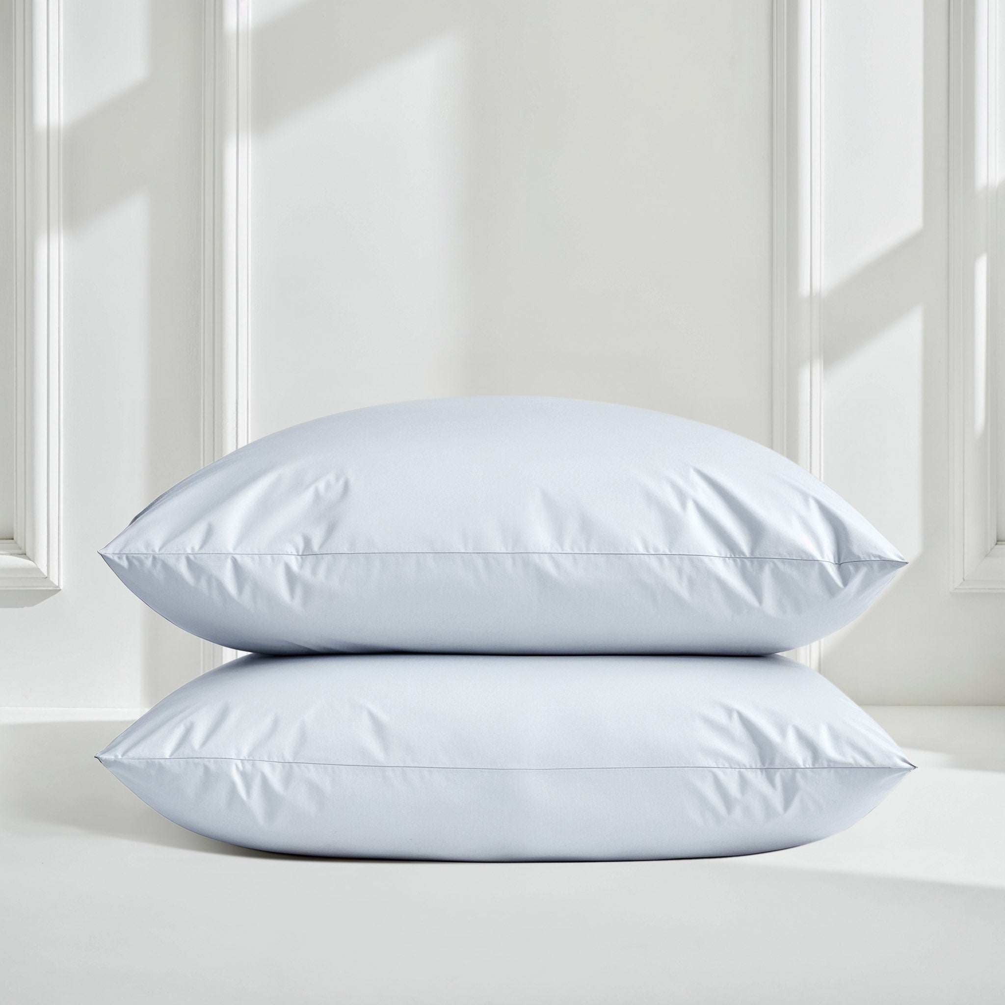 Luxe Australian Sateen Sheet Set with two pale blue sateen cotton pillowcases, smooth fabric and neat piped edges