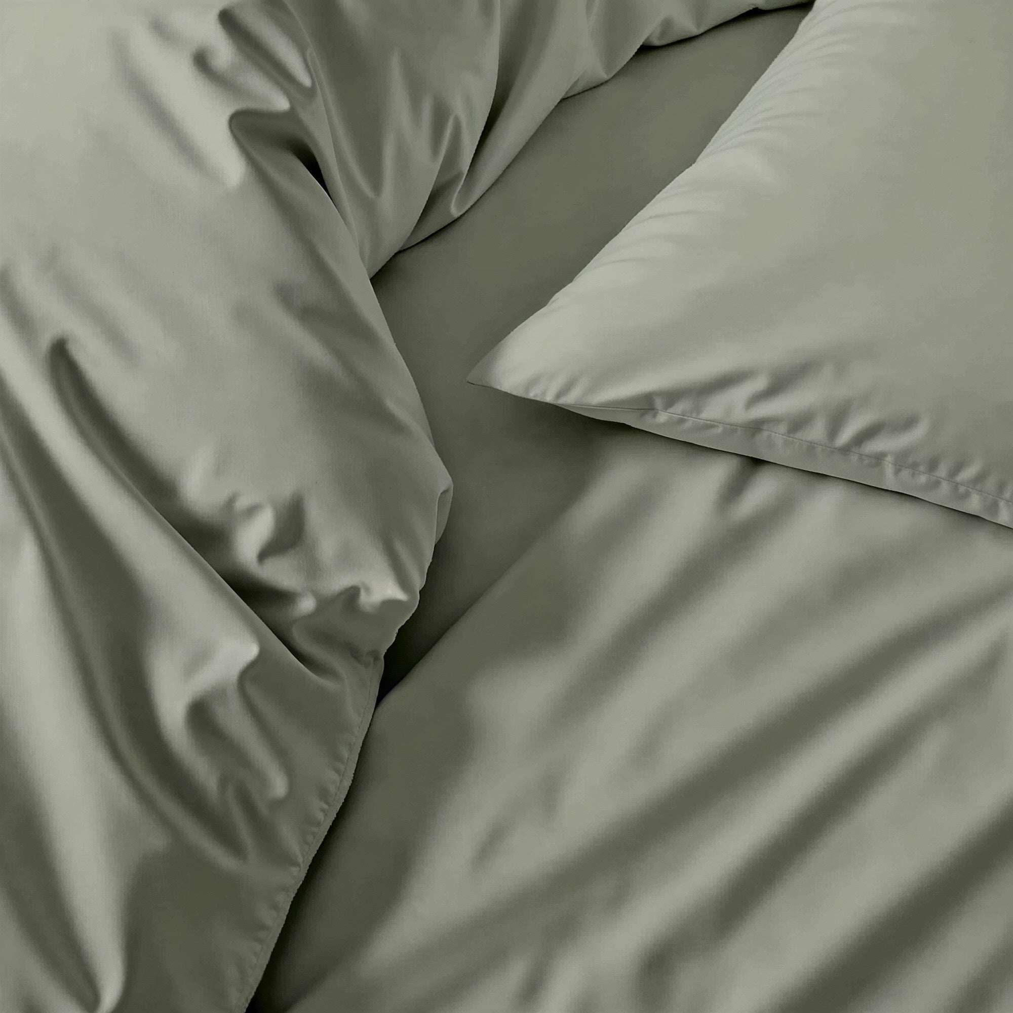 Luxe Australian Sateen Sheet Set in muted sage green cotton with a smooth, subtly lustrous finish and soft folds