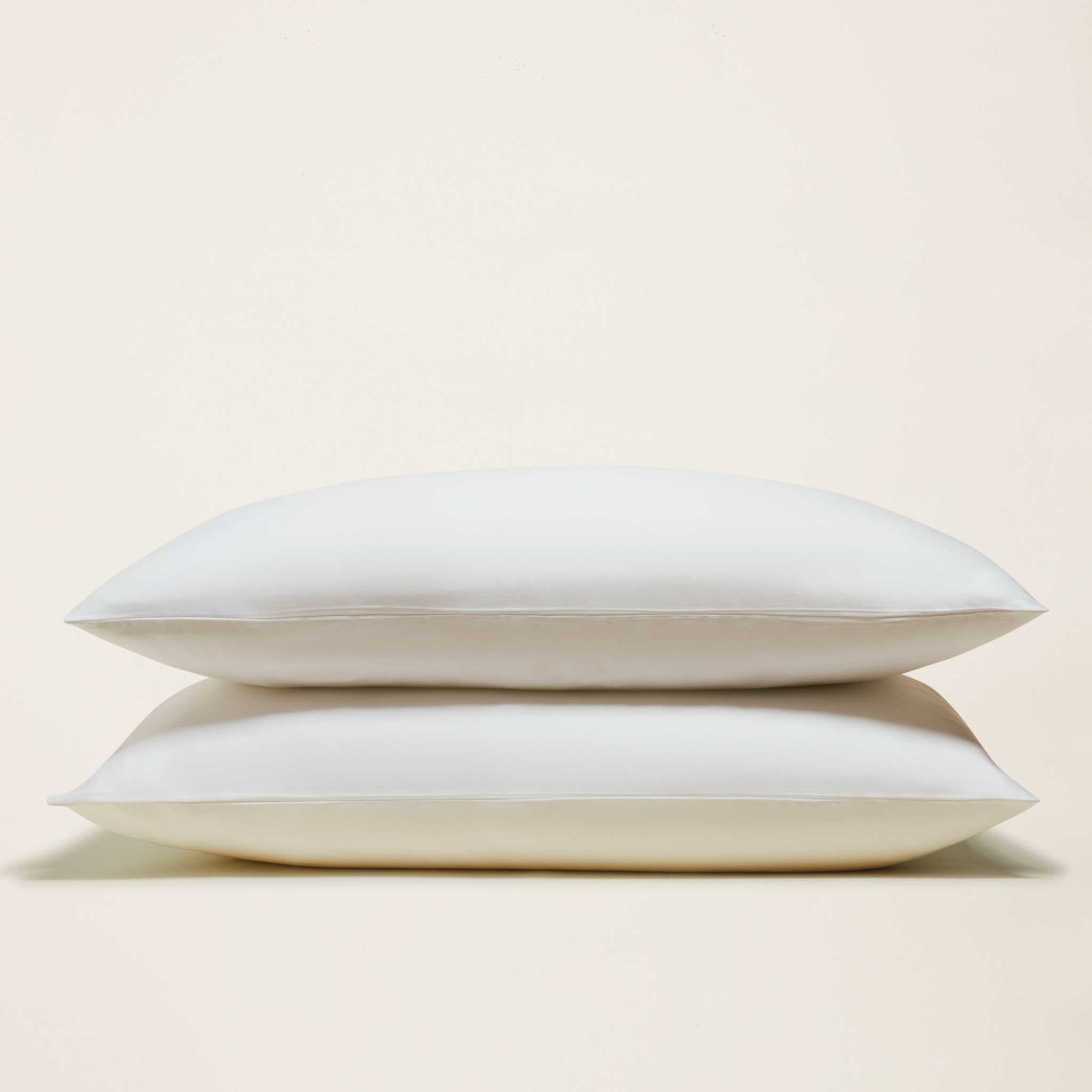 Luxe Australian Sateen Sheet Set features two smooth white cotton sateen pillowcases with neat piped edges
