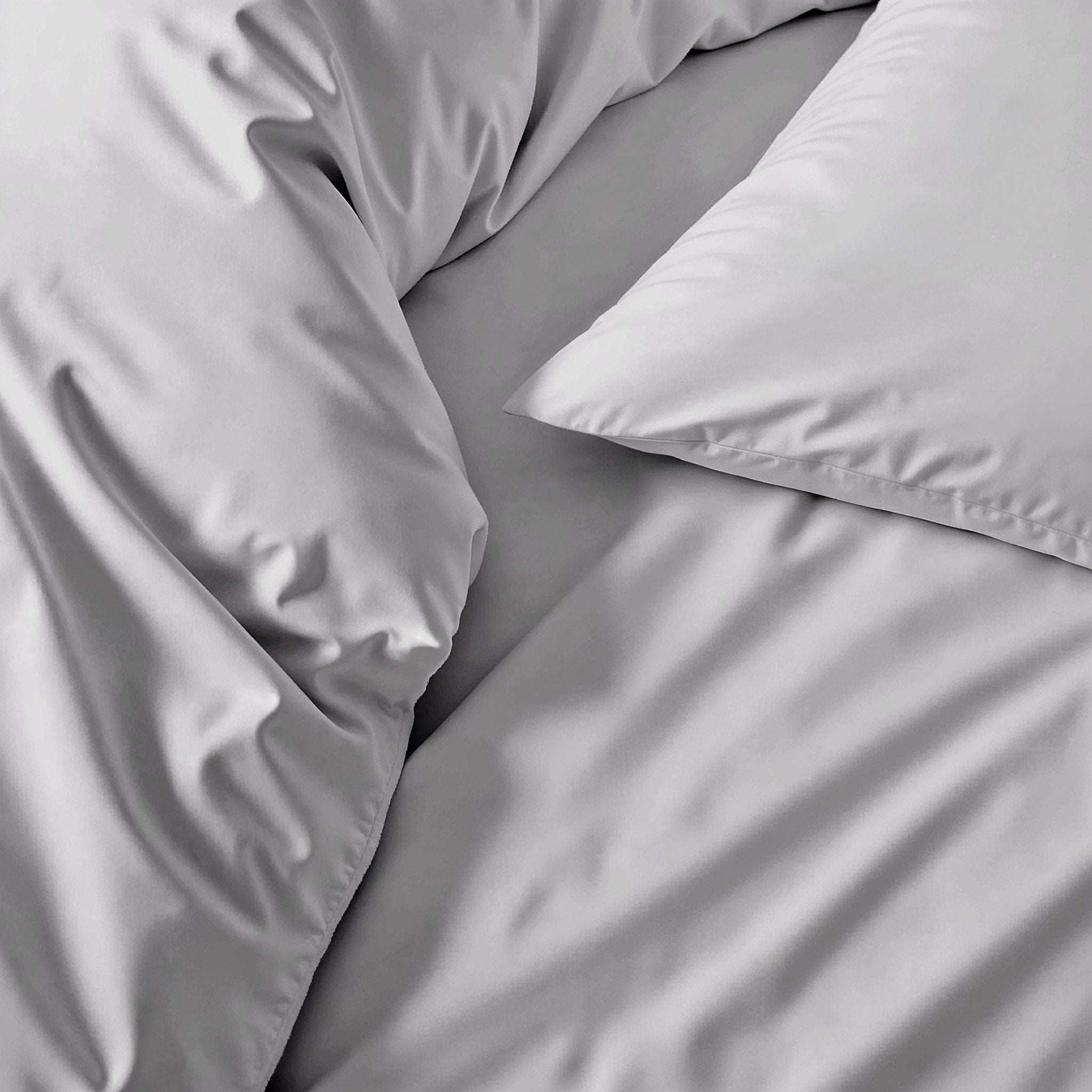 Luxe Australian Sateen duvet cover in smooth silver-gray cotton with a subtle sheen and matching pillowcase
