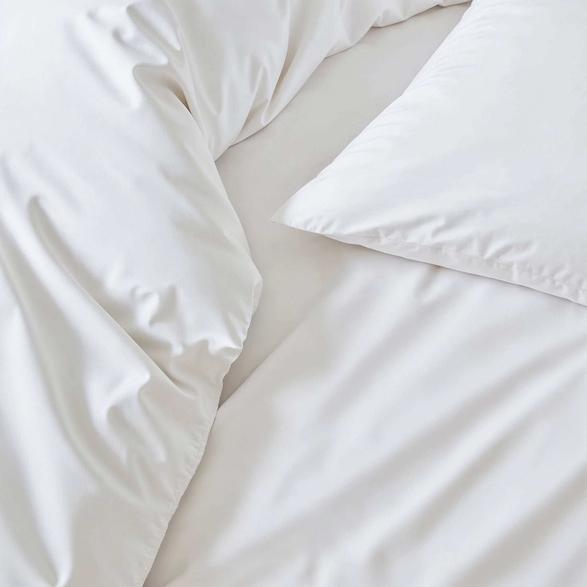 Luxe Australian Sateen duvet cover in white cotton with a smooth, subtly lustrous finish and coordinating pillowcase