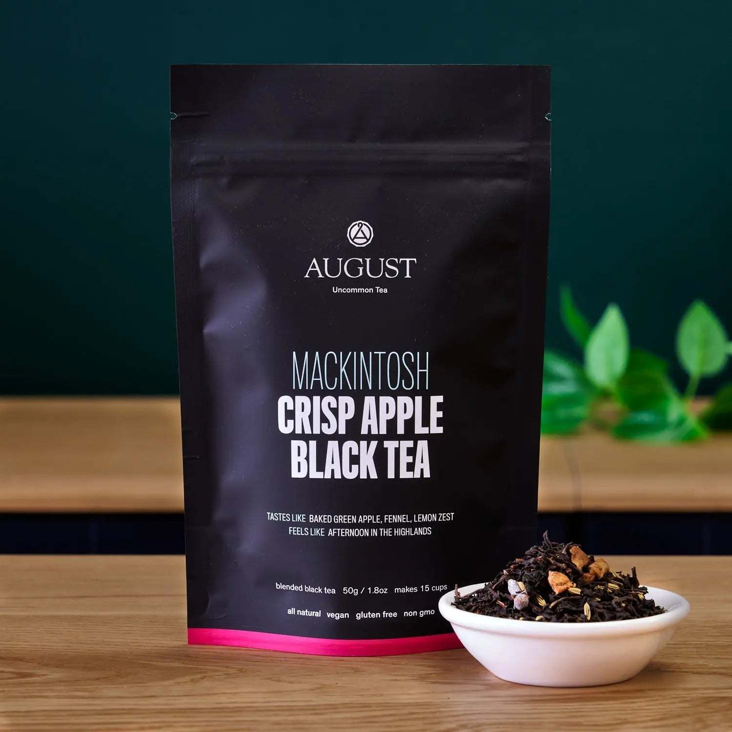 Mackintosh - Crisp Apple Black Tea in a black resealable pouch with pink trim and loose leaf tea sample