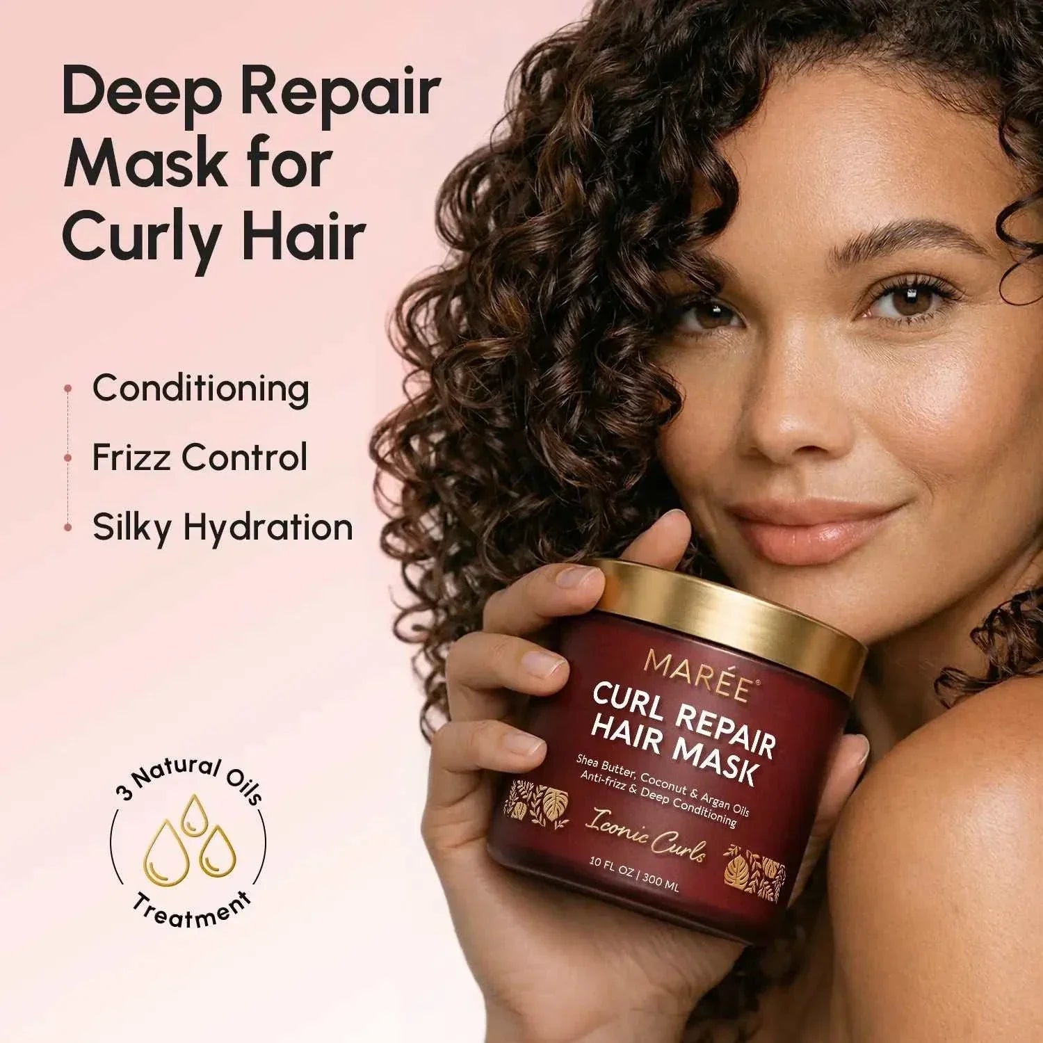 Maree Curl Repair Mask in a burgundy jar with a gold lid and botanical label, held beside defined curly hair.