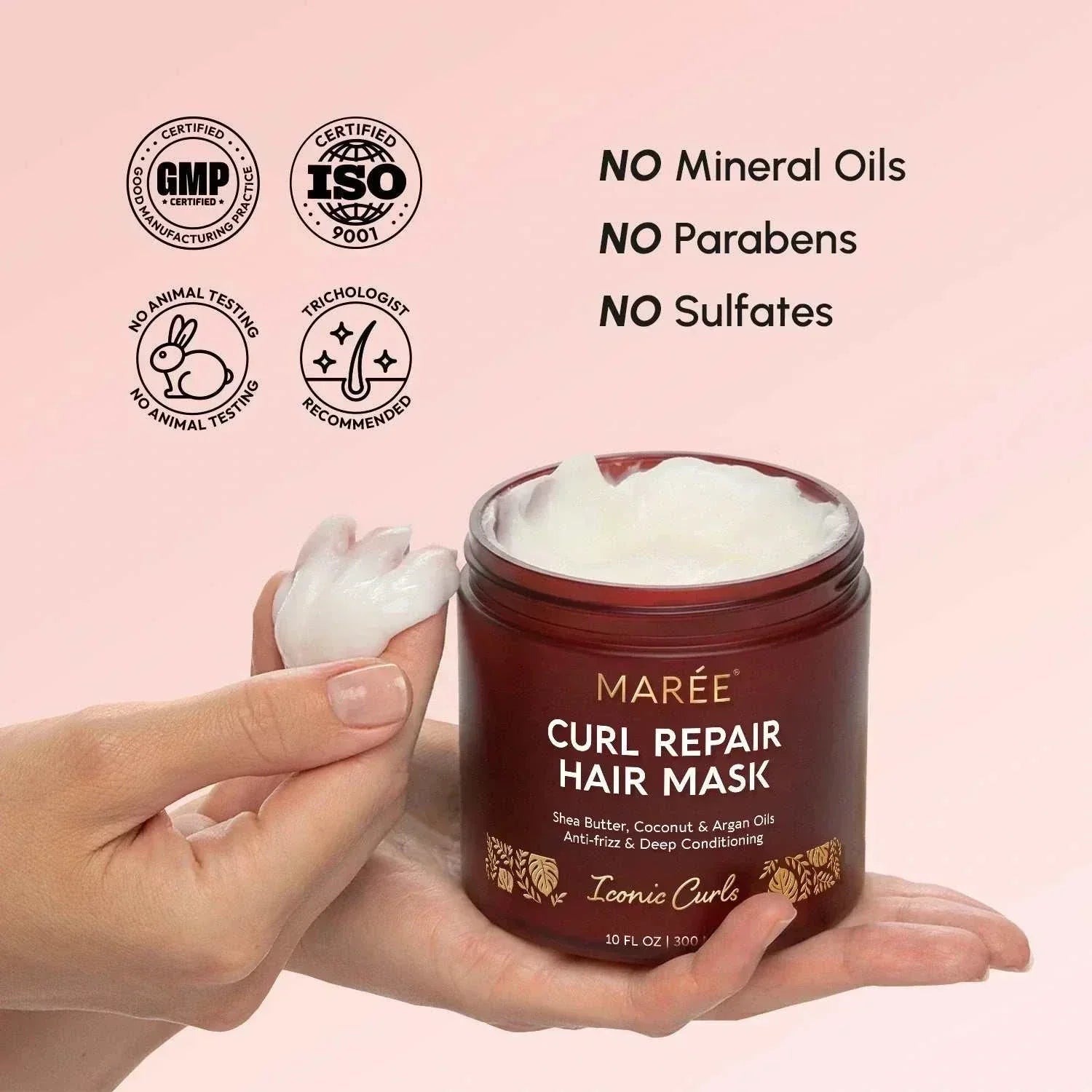 Maree Curl Repair Mask in a burgundy jar with a white creamy formula, shown with cream on fingertips