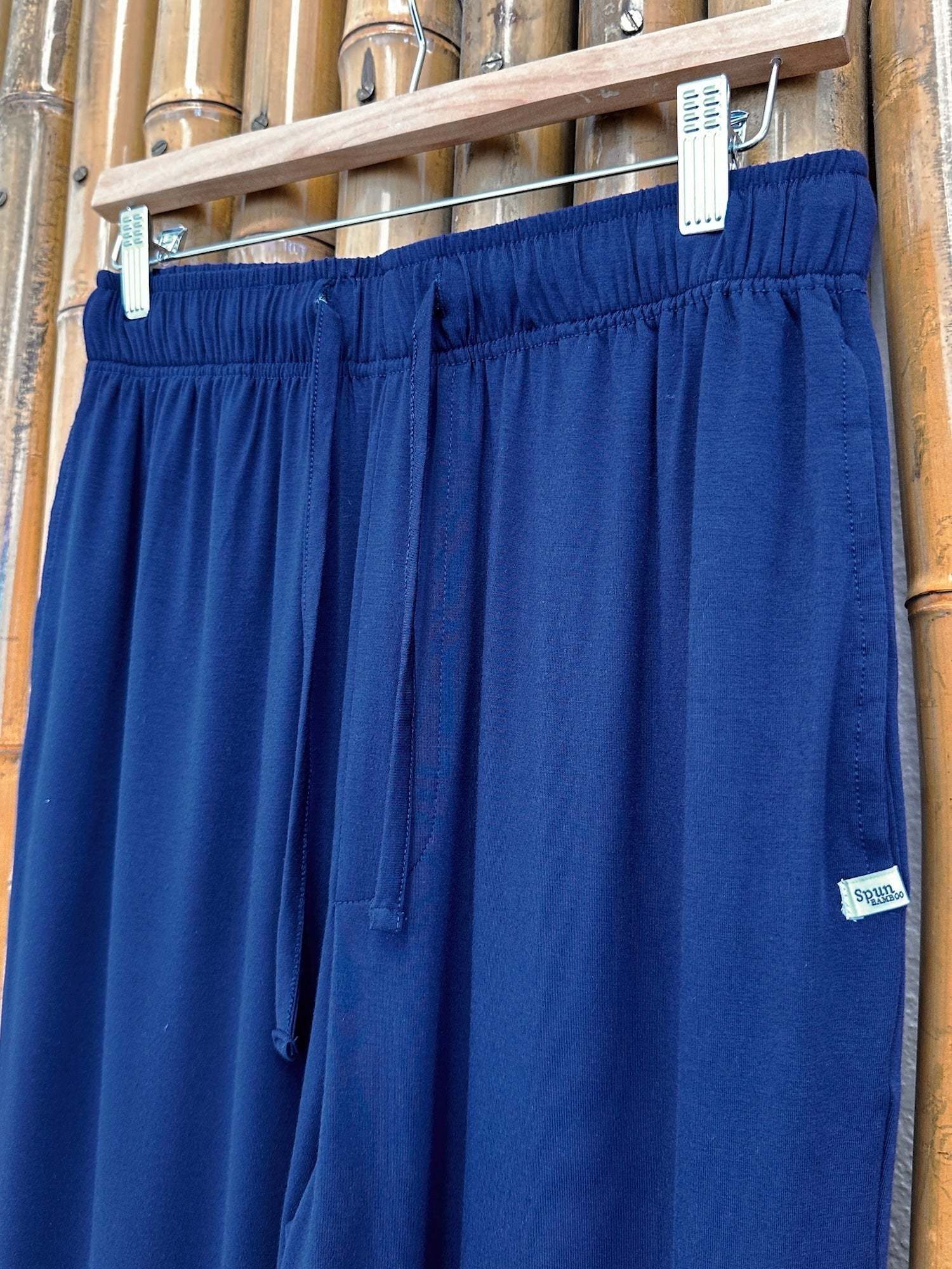 Men's Soft Bamboo Lounge Pajama Pants in solid navy blue with a soft draped fabric, elastic waistband and side pocket