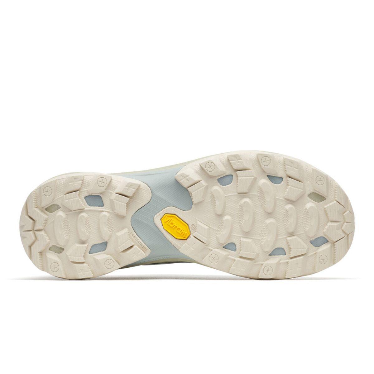 Merrell Women's Moab Speed hiking shoe outsole with a cream lugged tread, pale blue midfoot and yellow Vibram detail