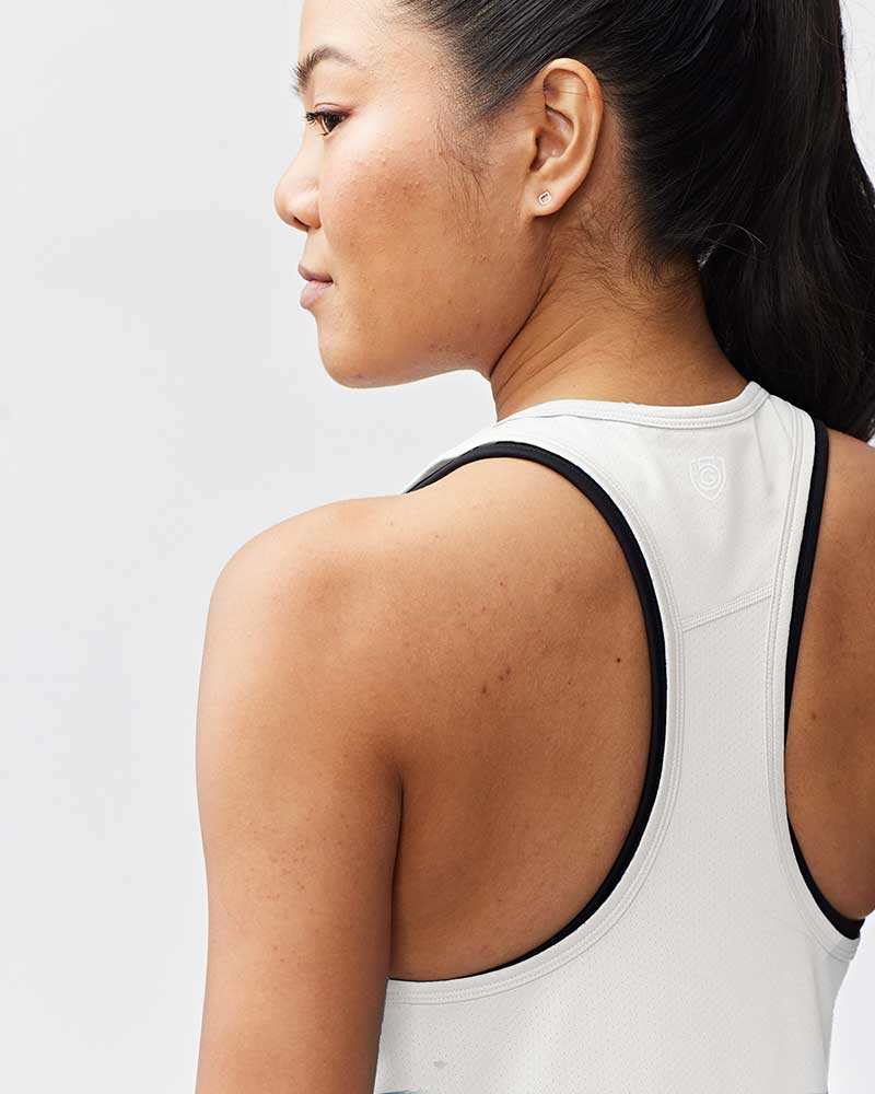 Mesh It To Me Tank, white mesh athletic tank with black trim, racerback cut and small logo on the back
