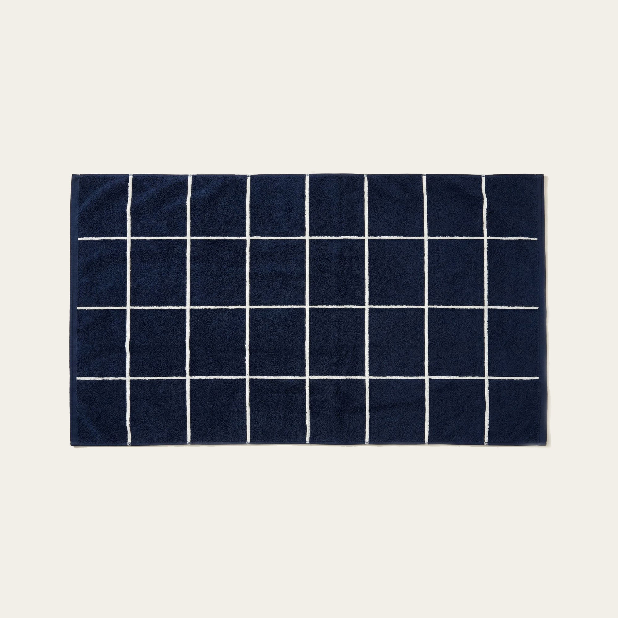 Miramar Australian cotton towels in navy blue and white windowpane grid