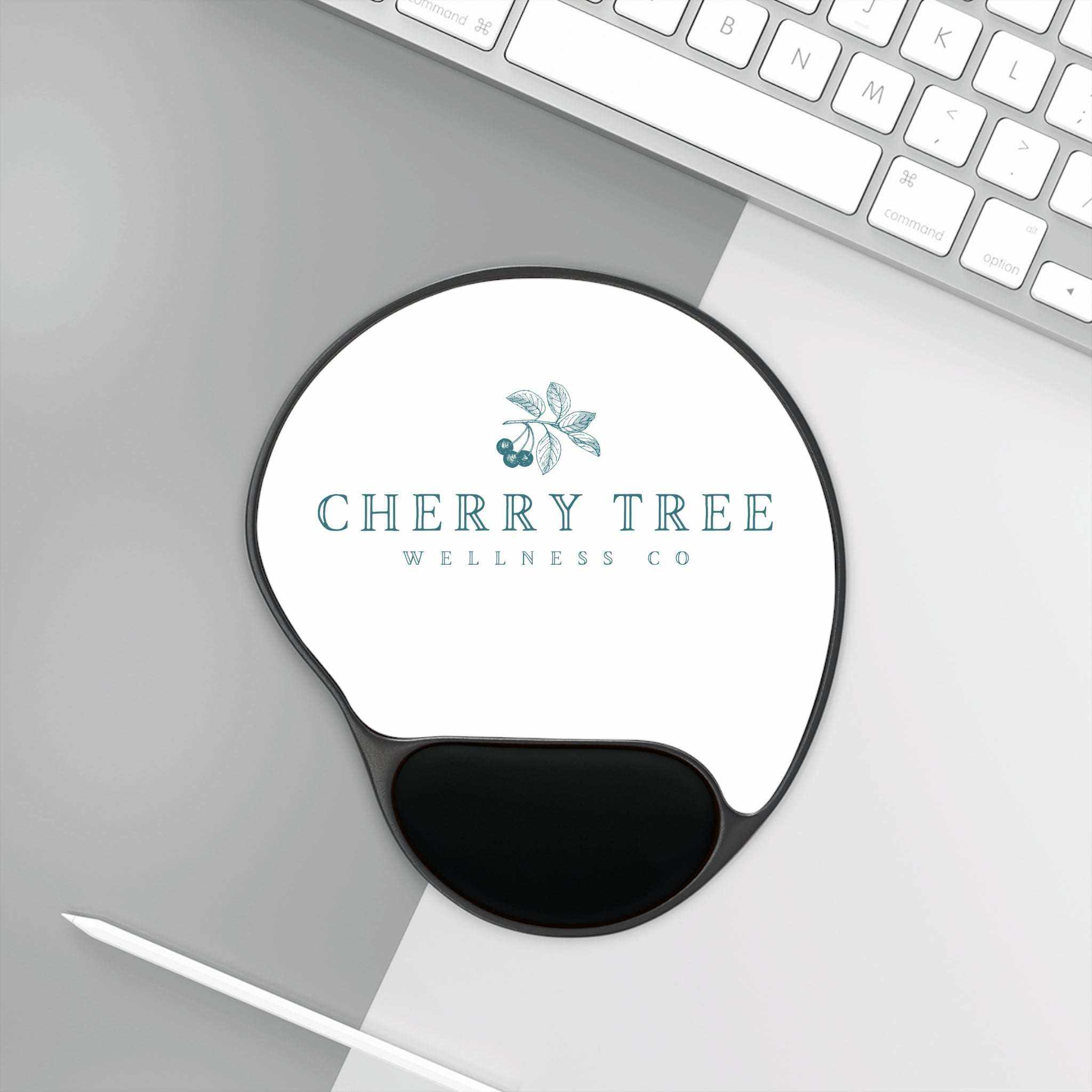 Mouse Pad With Wrist Rest featuring a white cherry tree logo insert, black foot-shaped base, and padded wrist support