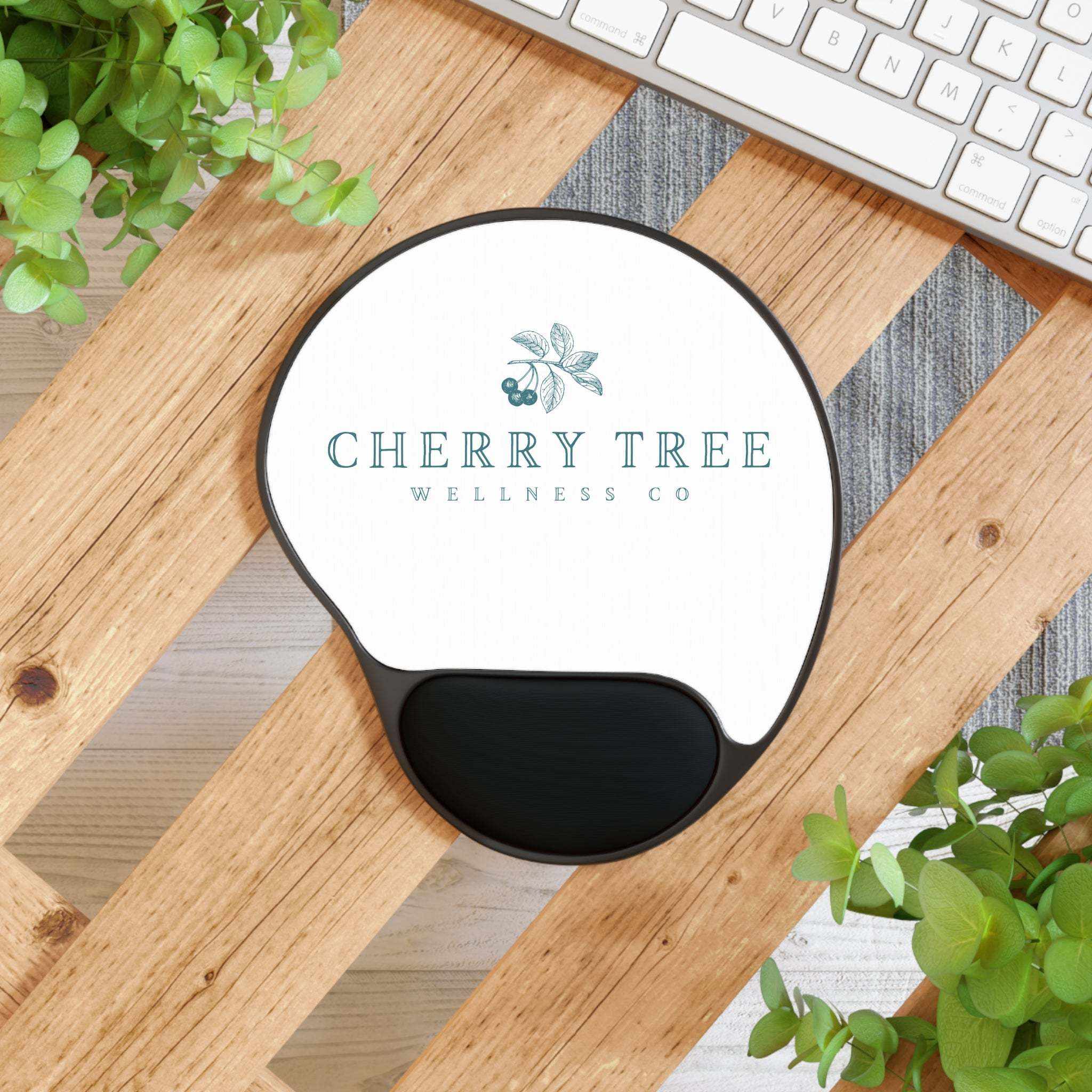 Mouse Pad With Wrist Rest featuring a white custom logo insert, black foot-shaped base, and ergonomic black wrist cushion