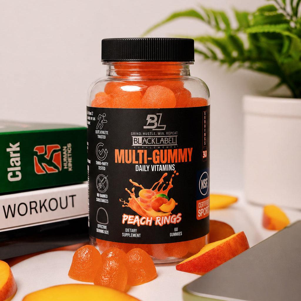 MULTI GUMMY peach ring vitamins in a clear jar with a black label and cap, filled with bright orange gummies