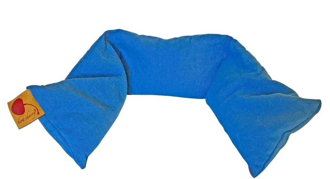 Neck Wrap in Blue Denim, a curved blue cotton wrap with three sewn sections and a small fabric tag