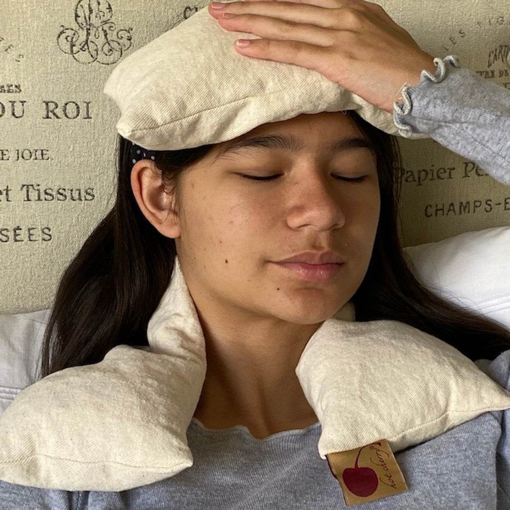 Neck Wrap in natural unbleached cotton denim, with a soft, plain fabric cover draped around the neck